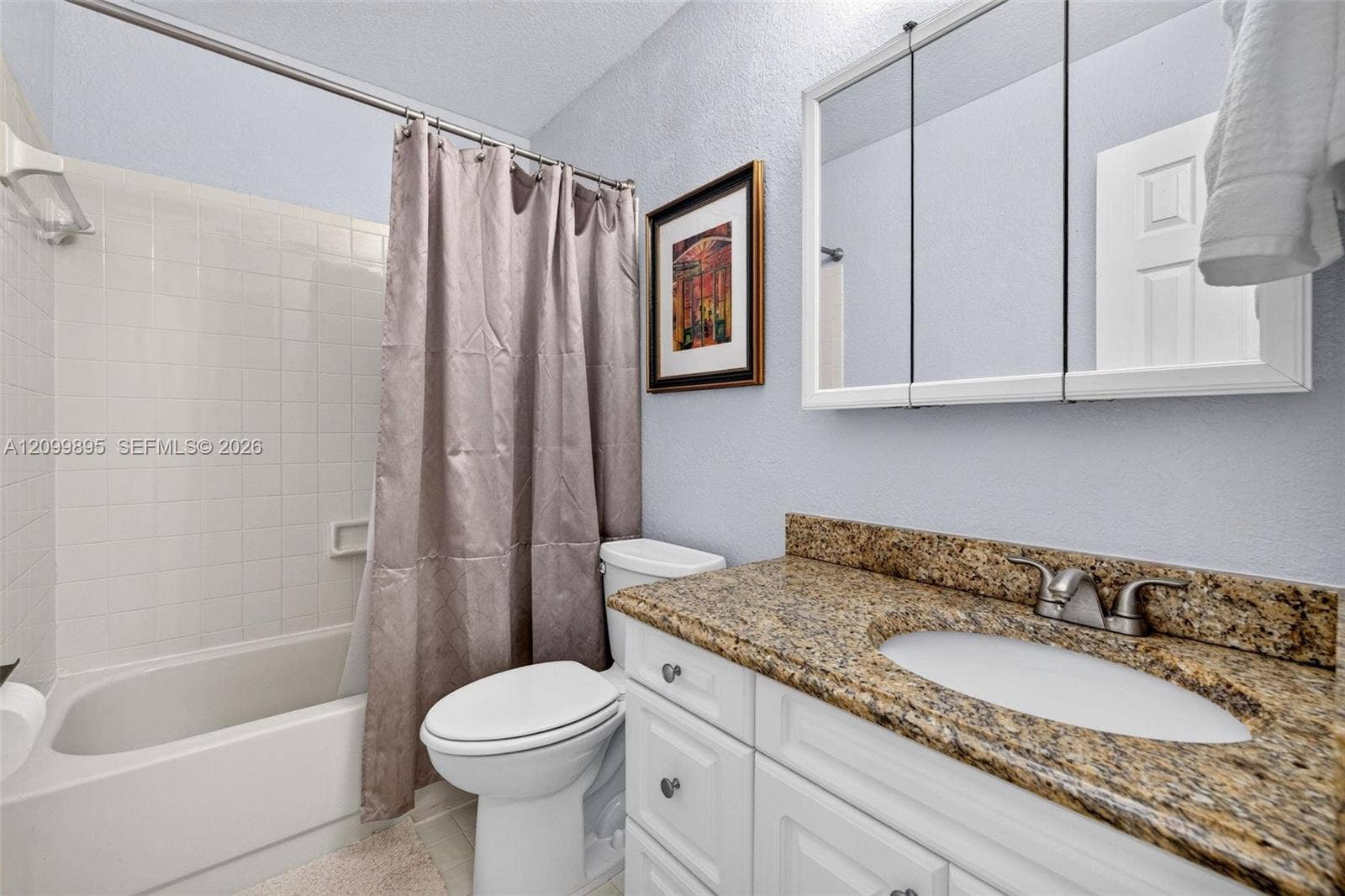 9012 Vineyard Lake Drive, Plantation, FL 33324 Well-maintained bathroom with a clean and functional design & granite counter.