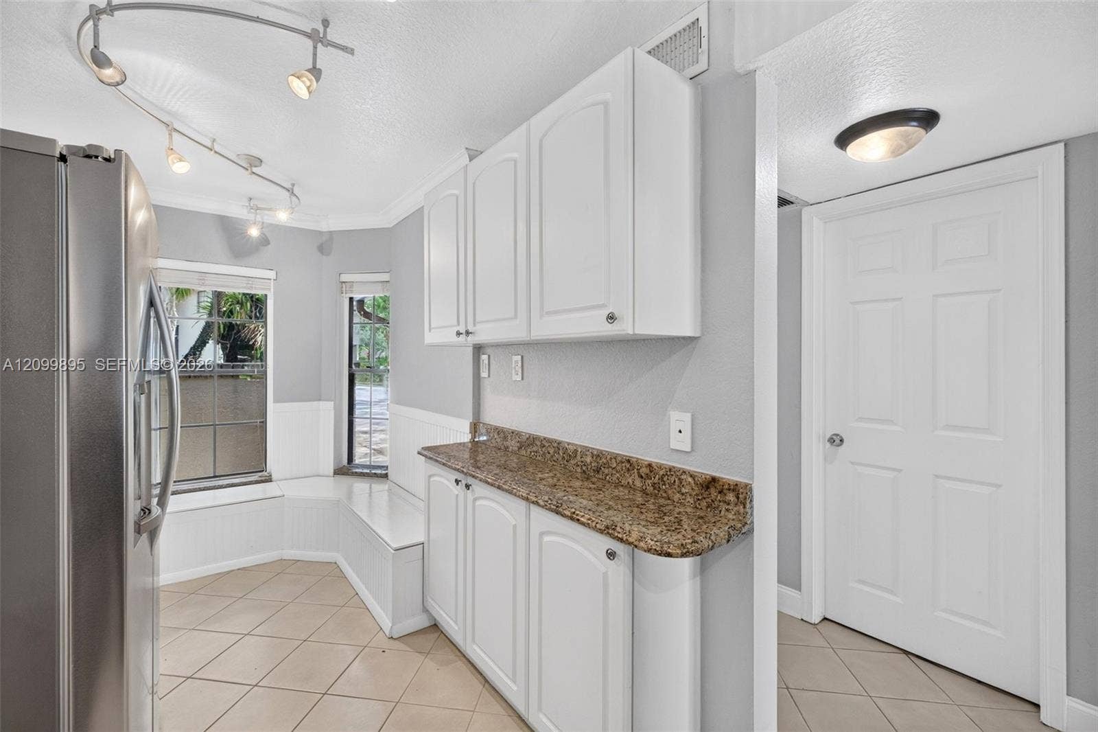 9012 Vineyard Lake Drive, Plantation, FL 33324 Well-equipped kitchen featuring ample cabinetry, a pantry and a convenient breakfast area.
