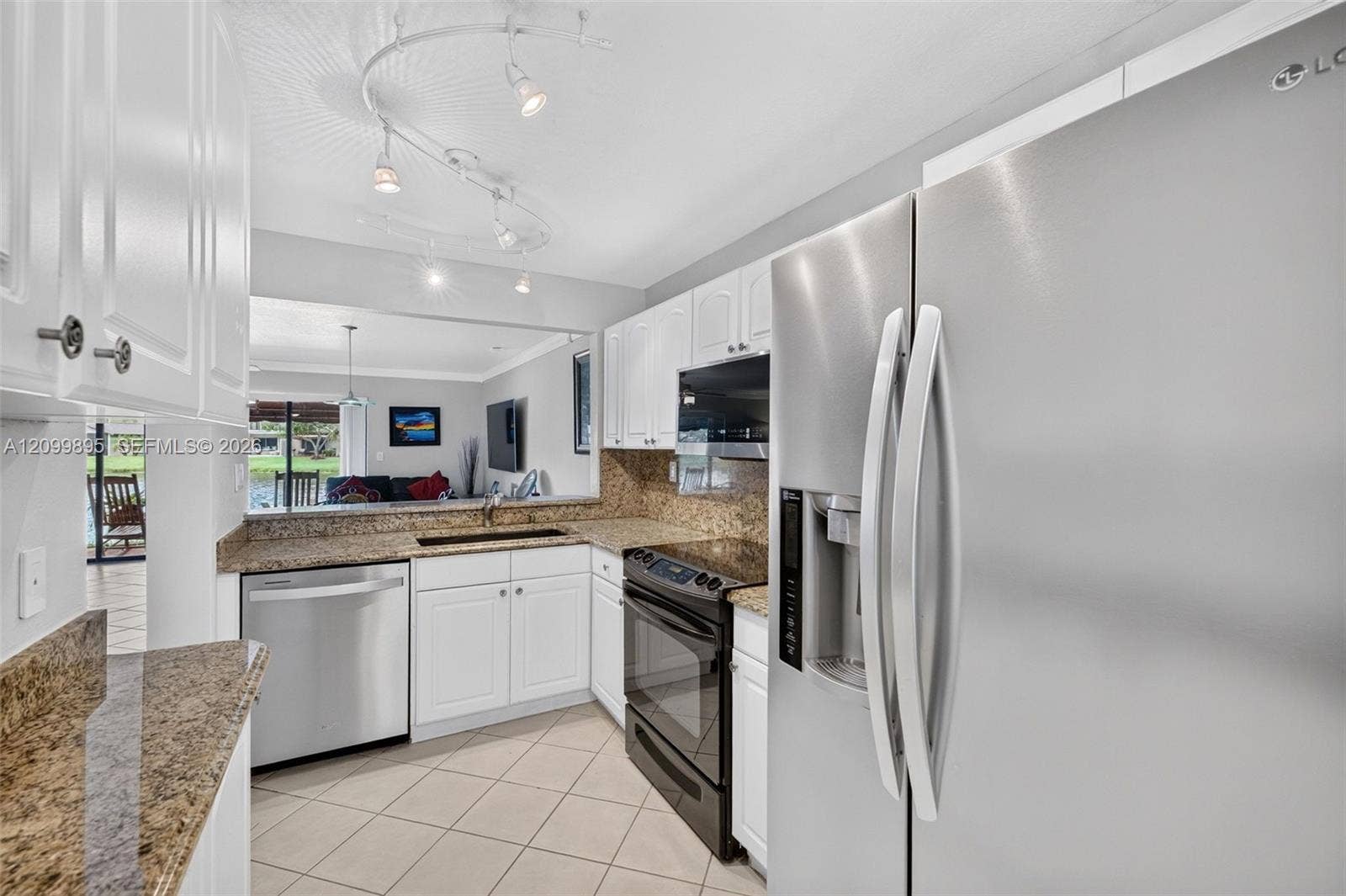 9012 Vineyard Lake Drive, Plantation, FL 33324 Well-equipped kitchen featuring ample cabinetry, a pantry and a convenient breakfast area.