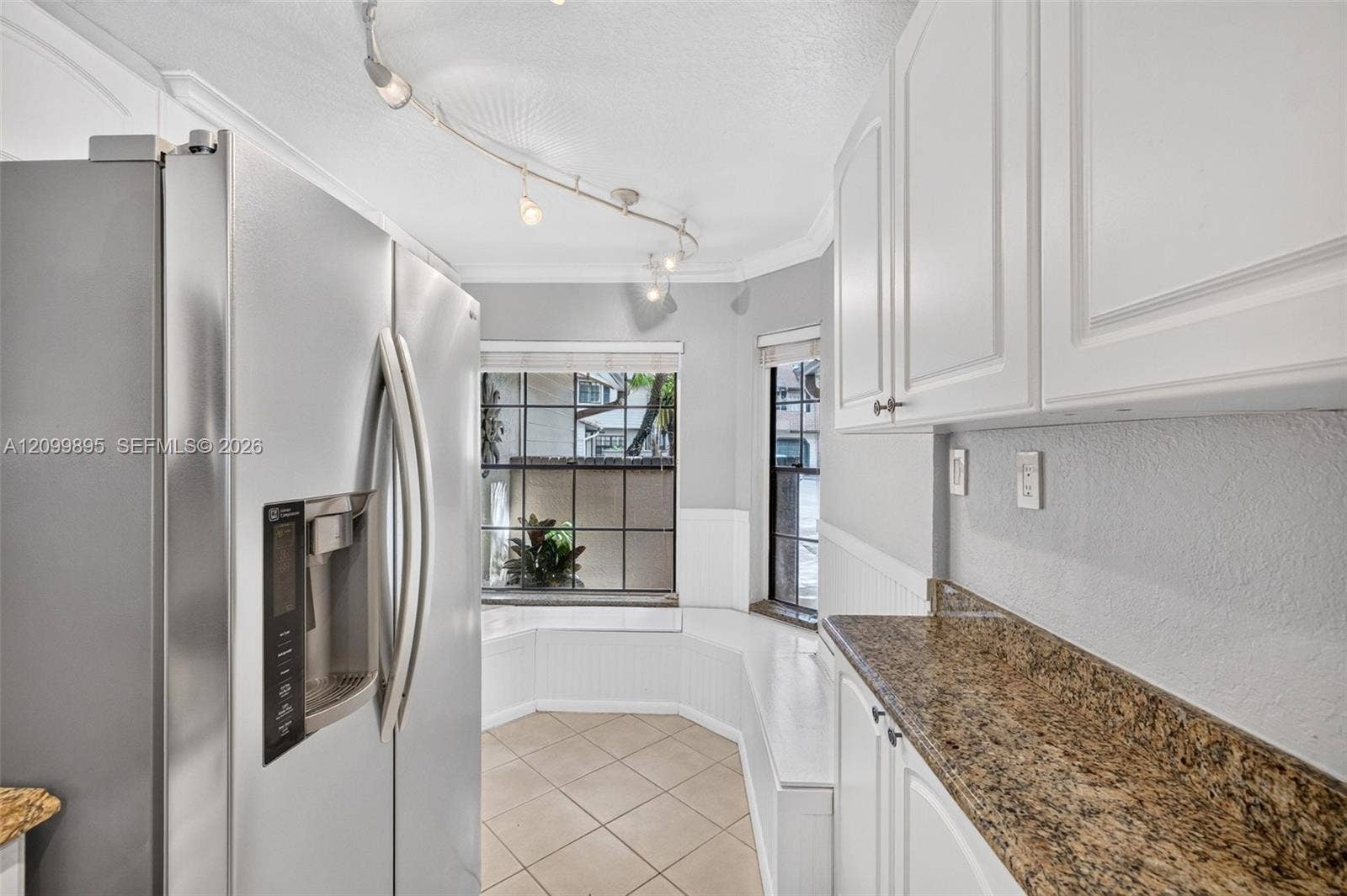 9012 Vineyard Lake Drive, Plantation, FL 33324 Well-equipped kitchen featuring ample cabinetry, a pantry and a convenient breakfast area.