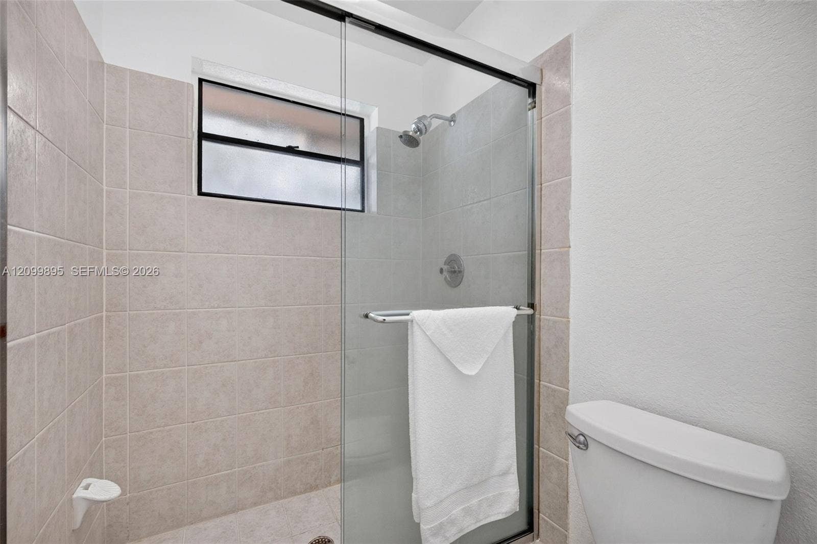 9012 Vineyard Lake Drive, Plantation, FL 33324 Well-maintained bathroom with a clean and functional design & granite counter.