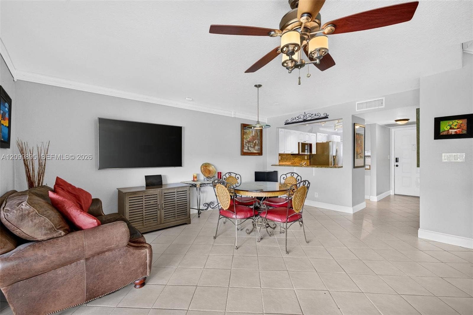 9012 Vineyard Lake Drive, Plantation, FL 33324 Spacious living area featuring an open layout and volume ceilings for a bright, airy feel.