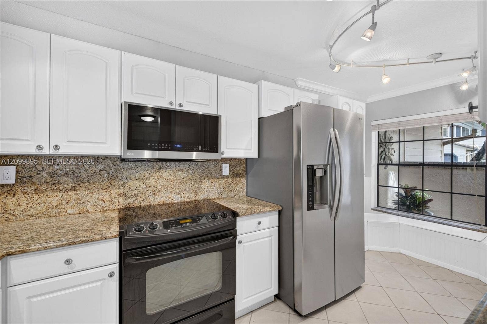 9012 Vineyard Lake Drive, Plantation, FL 33324 Well-equipped kitchen featuring ample cabinetry, a pantry and a convenient breakfast area.