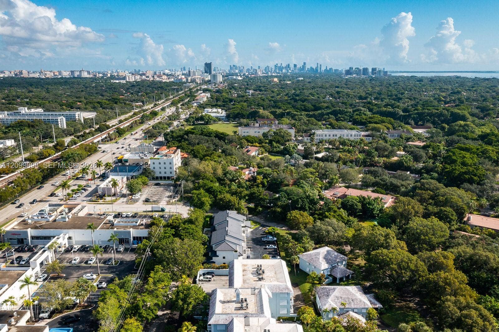 5750 Turin Street, #206, Coral Gables, FL 33146 Looking due in this picture is North East Downtown Miami and and a little to the right is Downtown Coconut Grove!By the way, the Miami International Airport is only a 20 minute to 3o minute drive from this unit, depending on the time one leaves for the Airport. During high traffic hours count on 30 minutes and at night or early morning about 15 minutes!