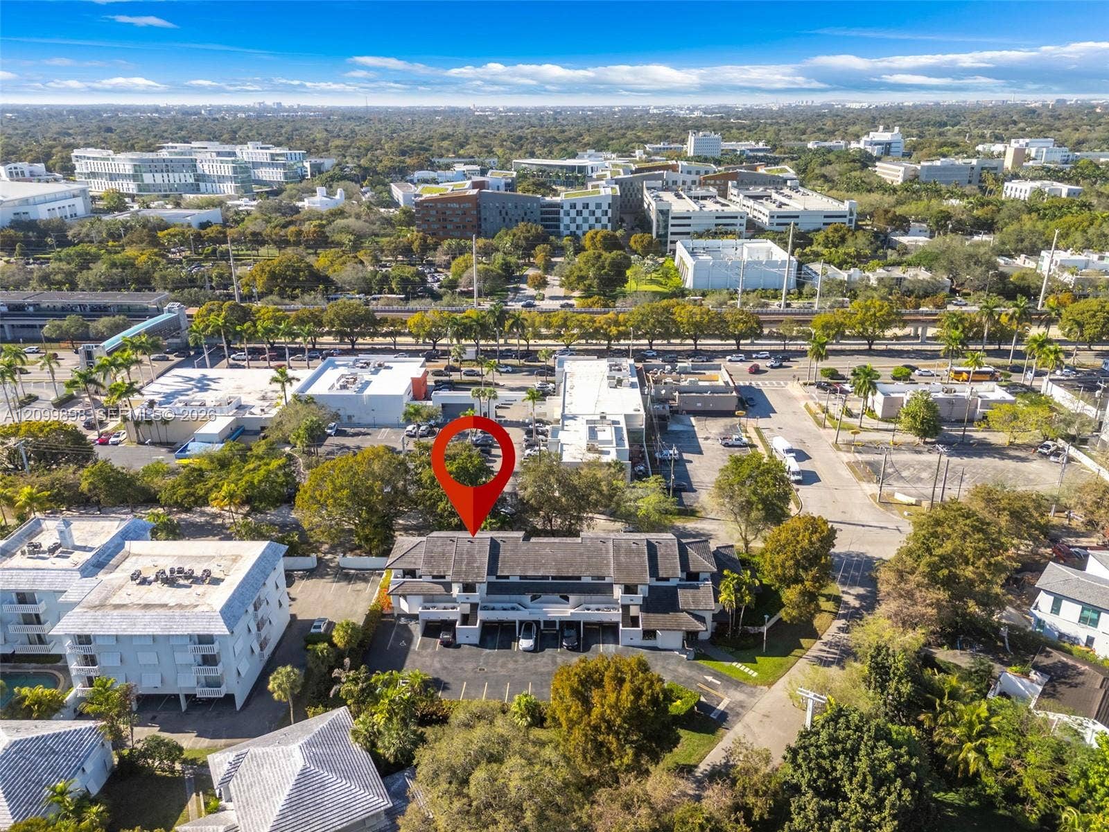5750 Turin Street, #206, Coral Gables, FL 33146 Looking North you can see that the Primary Bedroom and that the large balcony that faces the South side of the building and overlooks a tree lined area of a quiet residential neighborhood! And of course you can see the University of Miami Main Campus from the second Bedroom looking due North!!