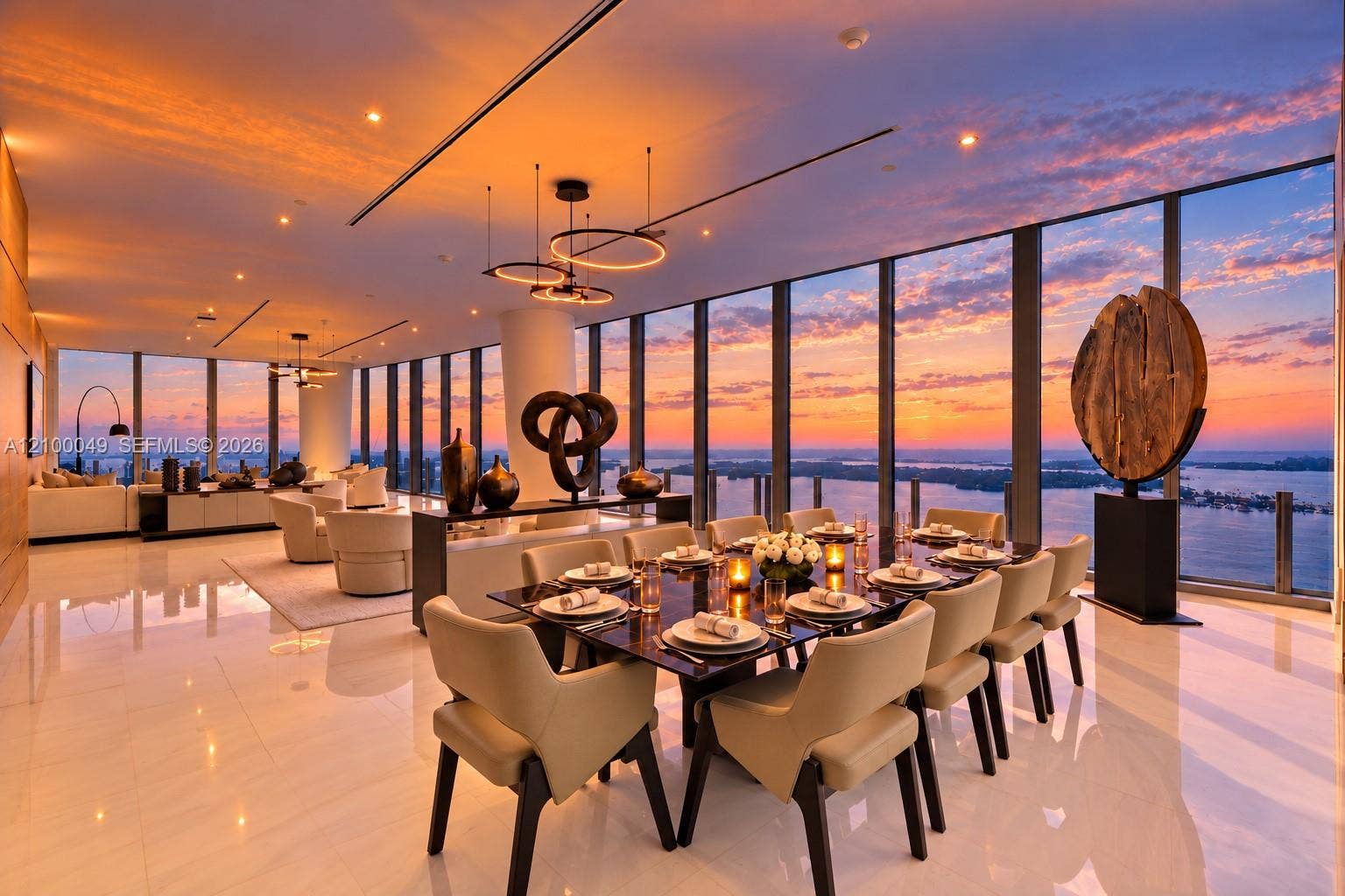 300 Biscayne Boulevard Way, #PH6001C, Miami, FL 33131 Expansive floor-to-ceiling windows, polished floor tiles, modern recessed lighting, contemporary pendant light fixtures, and a wood accent wall