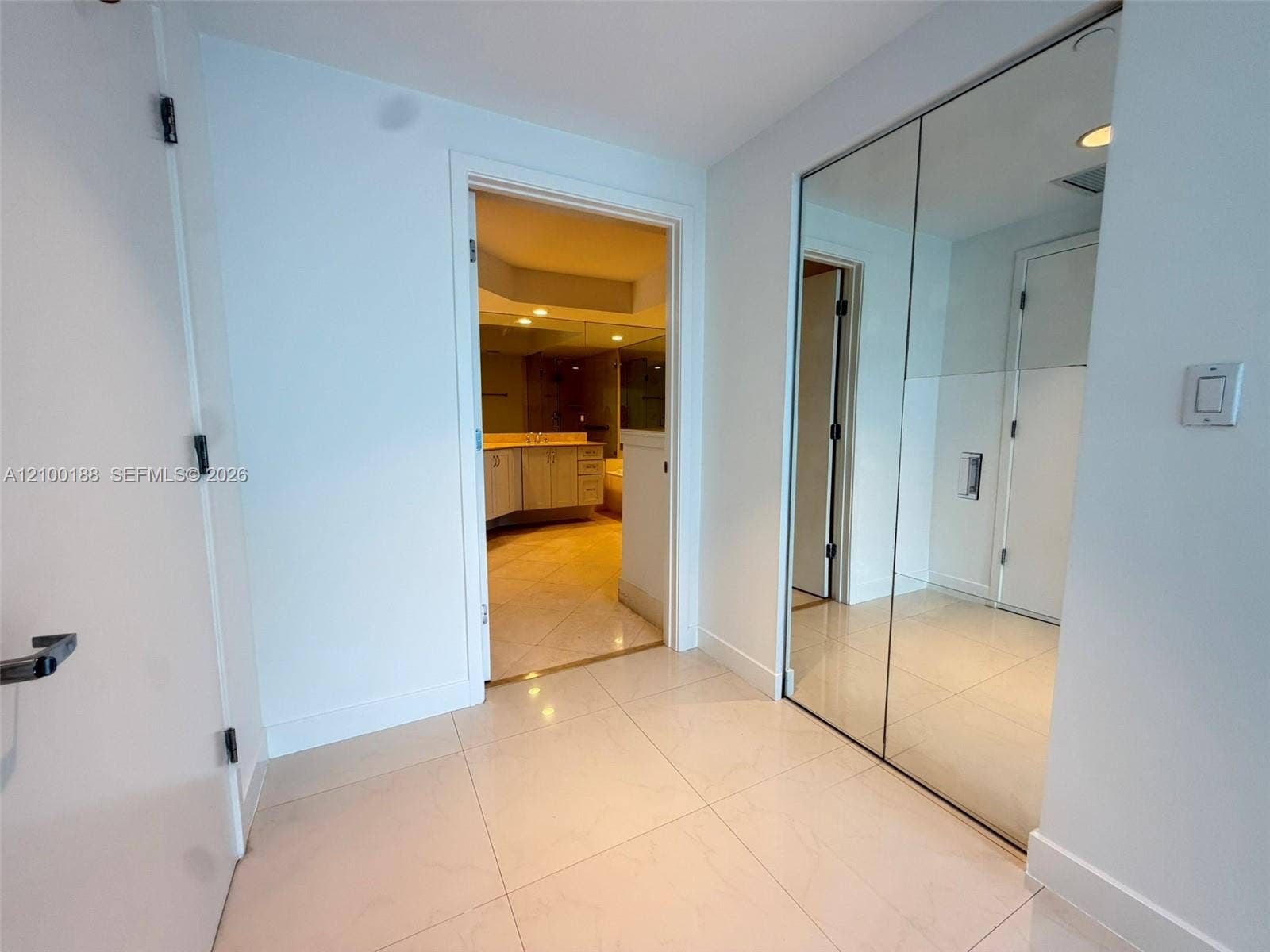 2821 N Ocean Boulevard, #305S, Fort Lauderdale, Fort Lauderdale, FL 33308 Large-format tile flooring, dual-panel mirrored closet doors, and solid-core interior doors