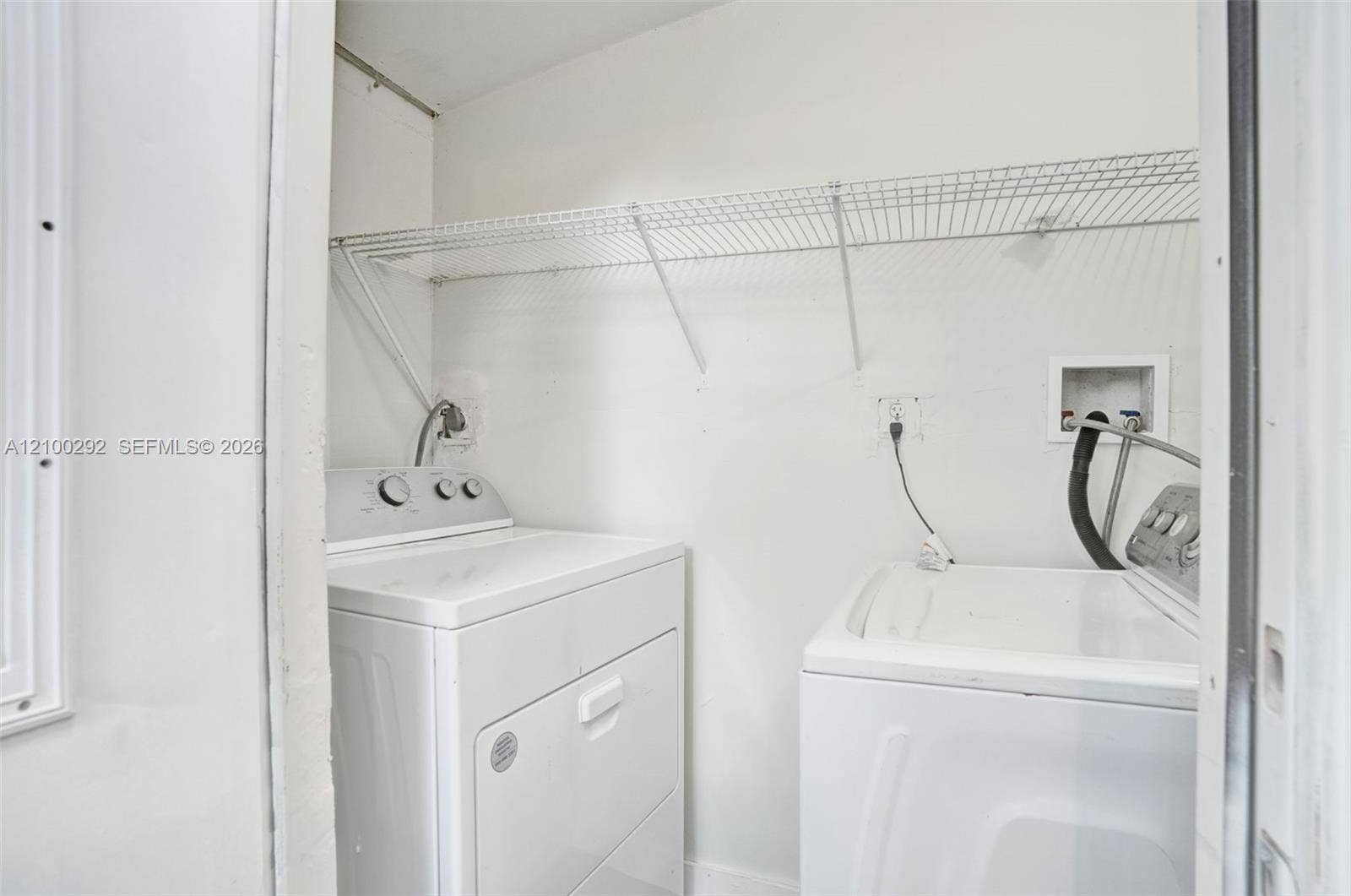 Laundry with full size washer and dryer off the bedroom.