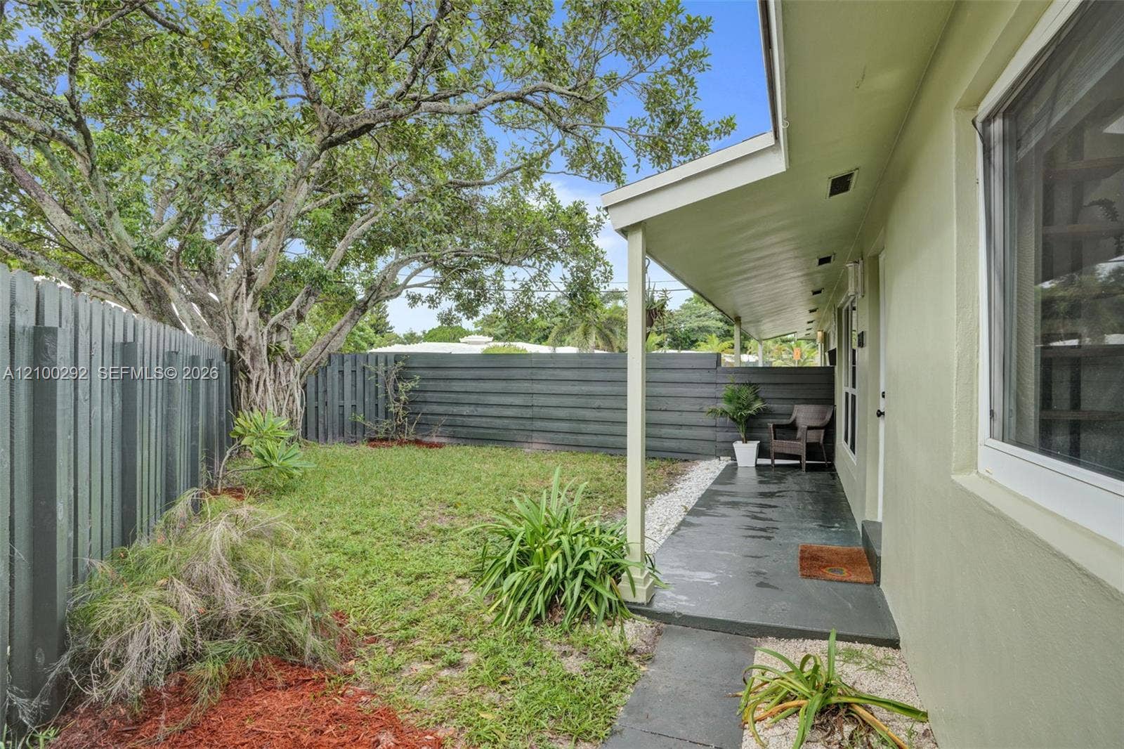 Private outdoor space, fully enclosed and accessible from the front door by the living room.