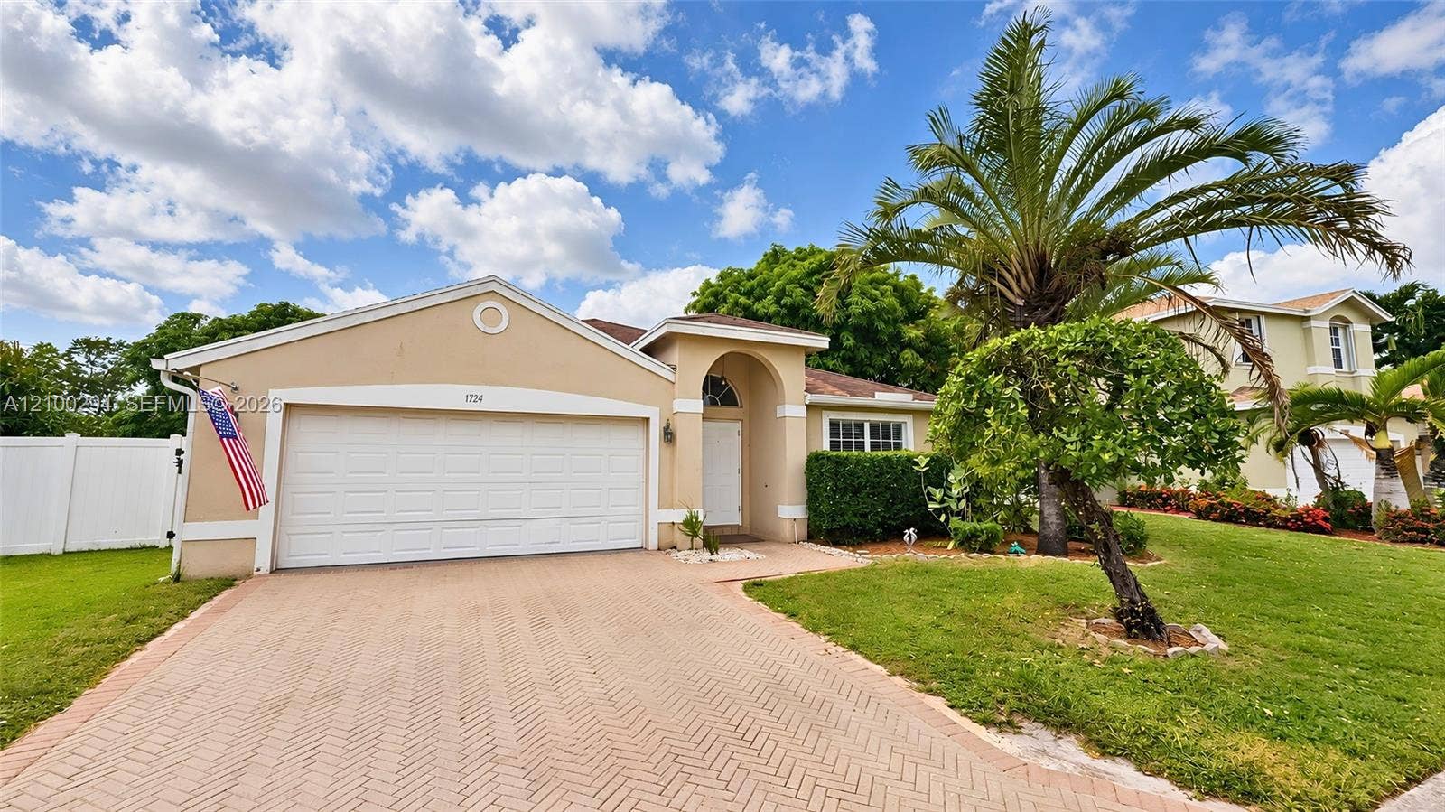Single-story exterior paved 2 car garage