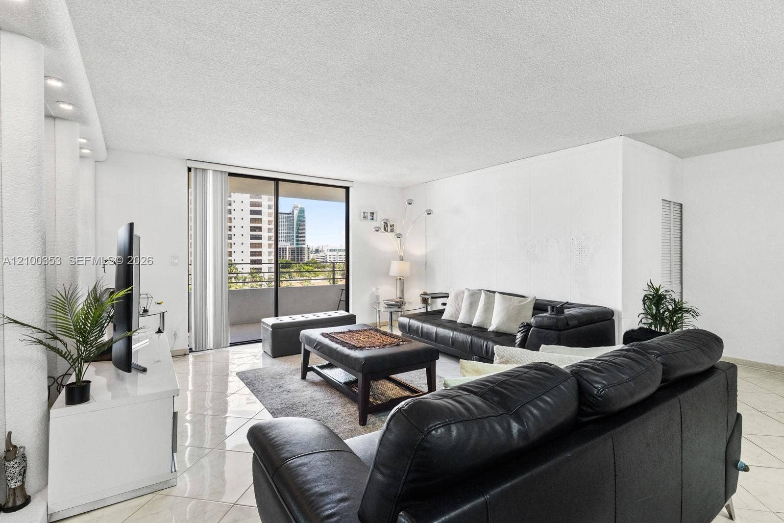 600 Three Islands Boulevard, #612, Hallandale Beach, FL 33009 Living room opening to the balcony