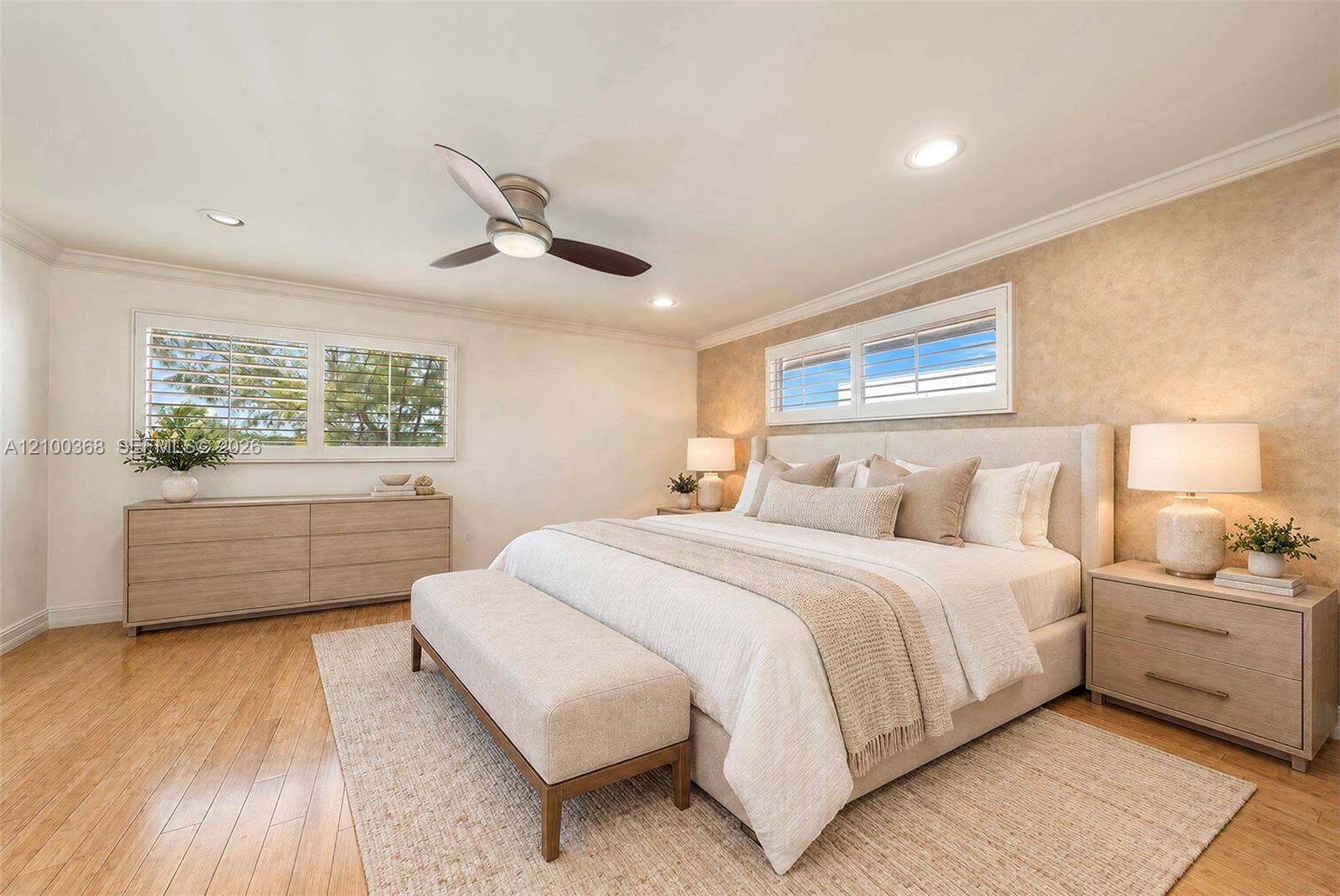 Wood-finish flooring, recessed lighting, ceiling fan with integrated light, horizontal window shutters, and textured wall finish