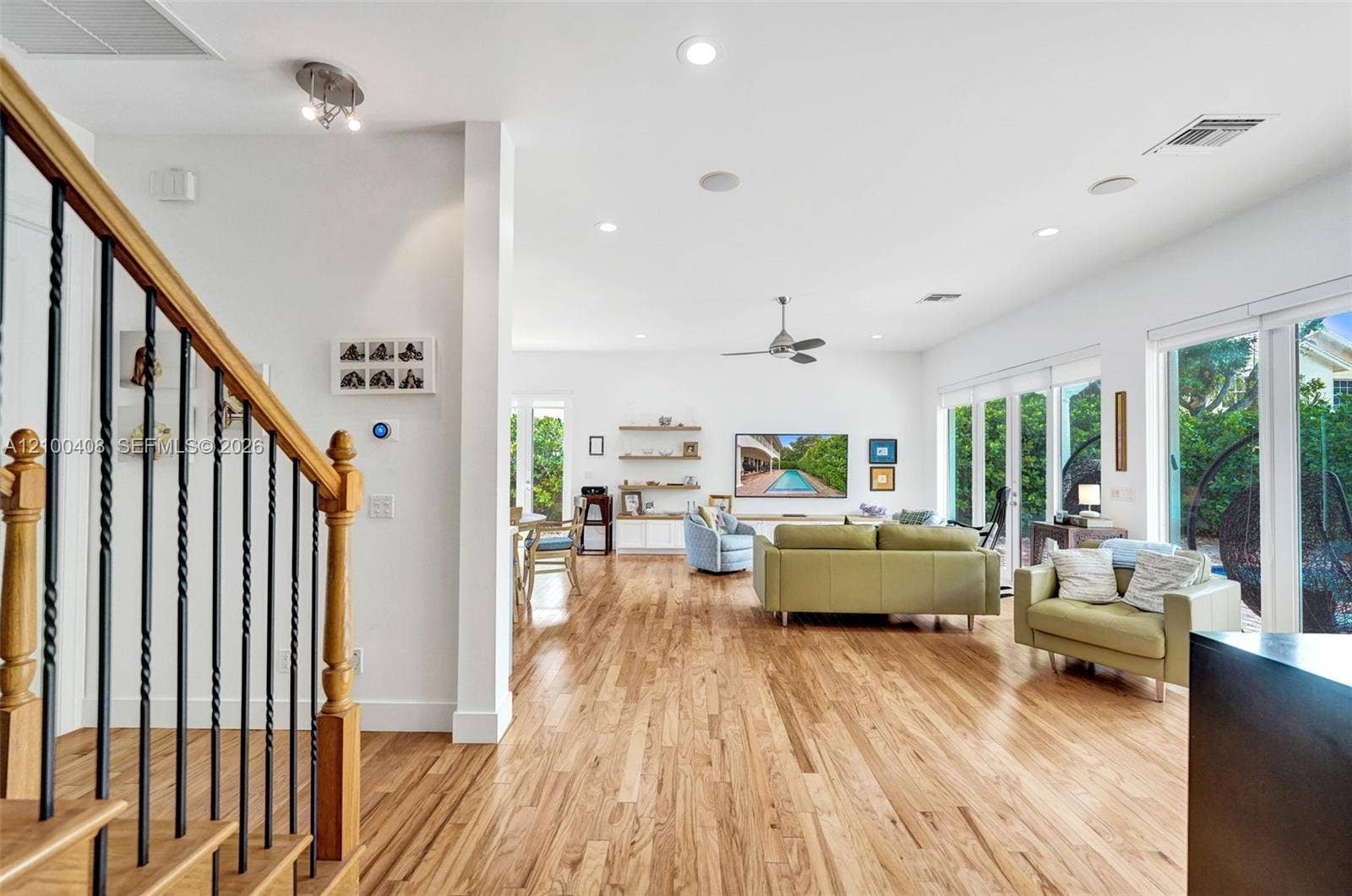 1950 Blue Water Terrace S, Lauderdale By The Sea, FL 33308 Large, open living room with all impact windows and sliding glass doors out to the pool/patio.