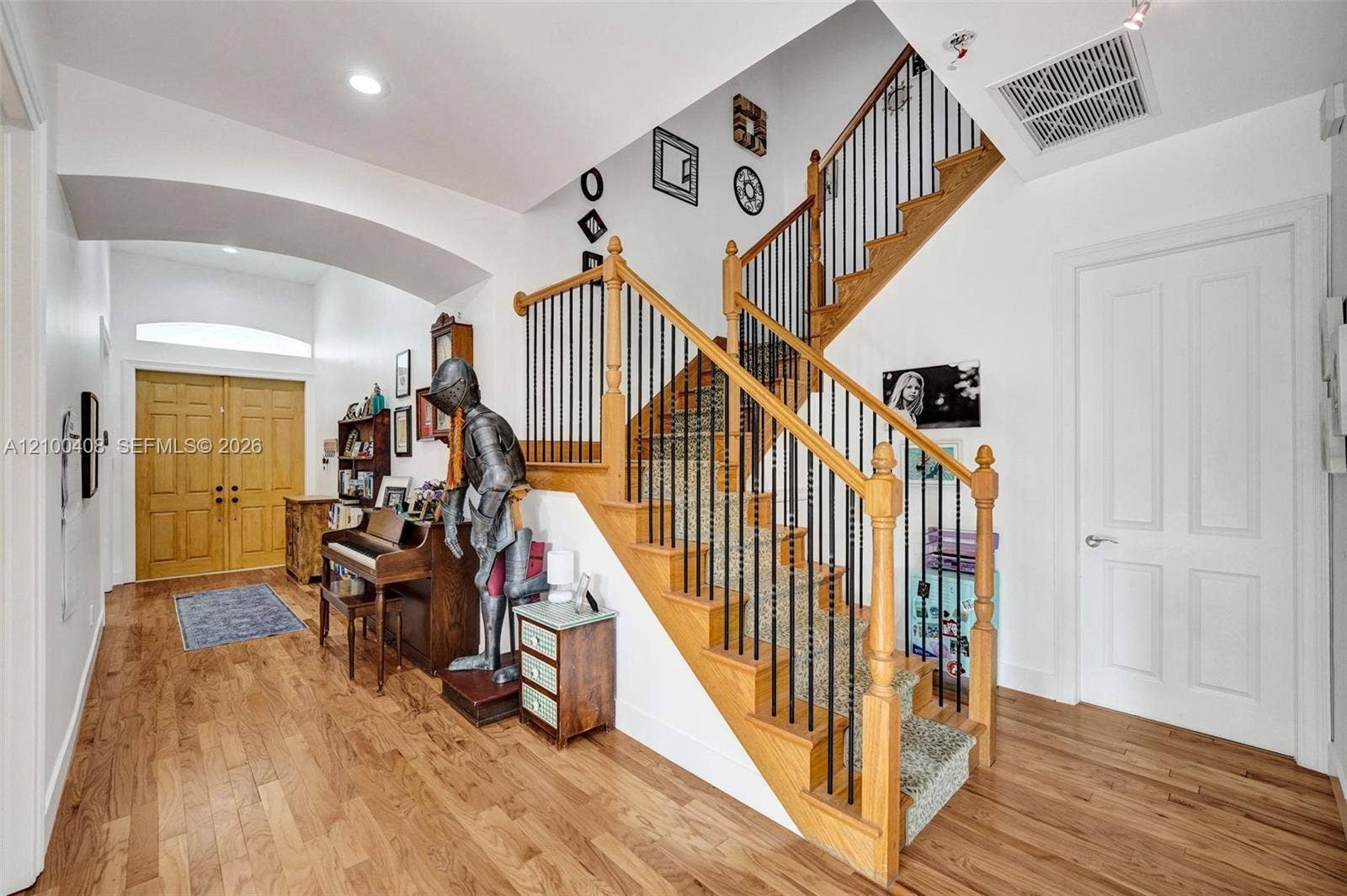 1950 Blue Water Terrace S, Lauderdale By The Sea, FL 33308 Wood floors carry up the stairwell.
