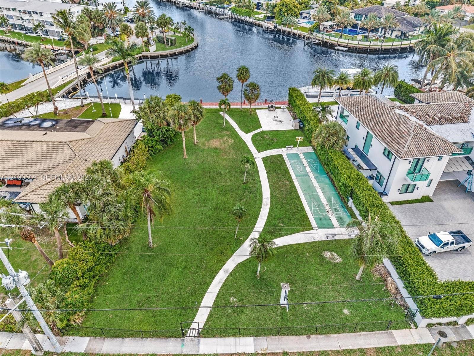 Enjoy condo-owned private park across the street with dock