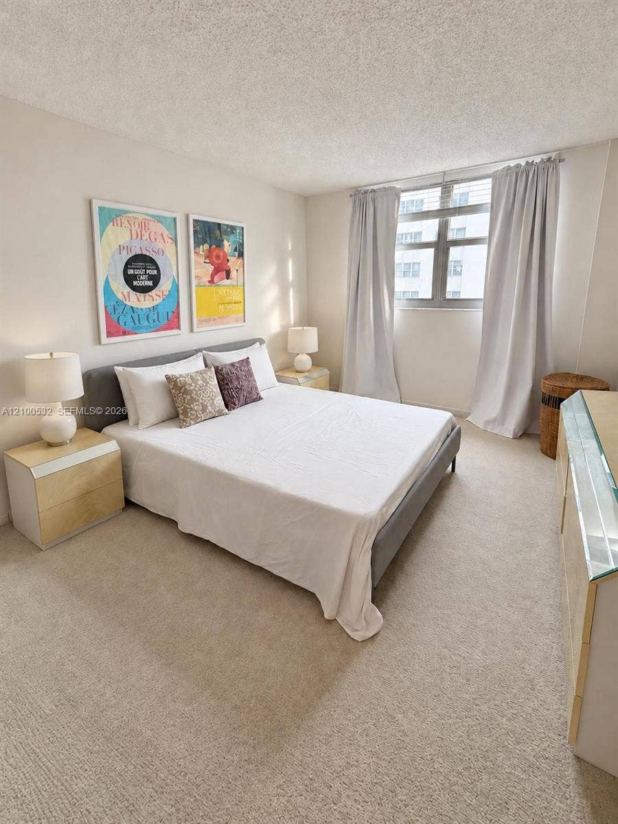9273 Collins Avenue, #912, Surfside, Surfside, FL 33154 Neutral interior featuring wall-to-wall carpeting and a multi-pane window
