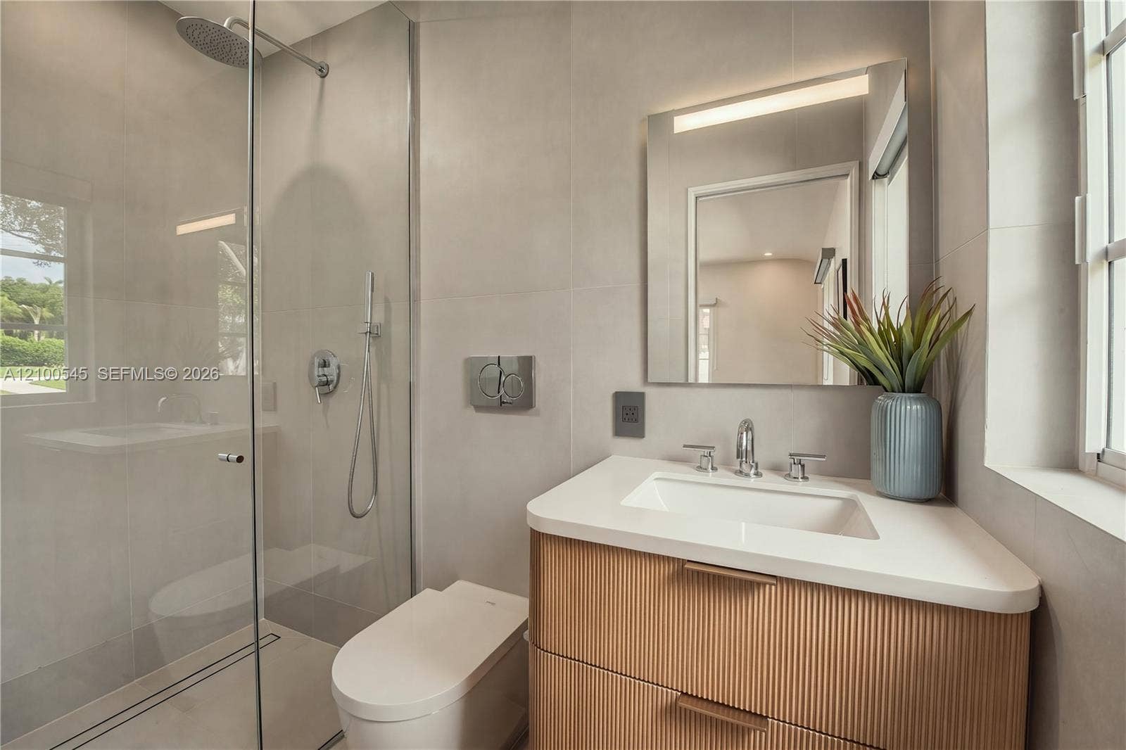 1042 NE 95th Street, Miami Shores, FL 33138 Luxe en-suite bathroom with shower.
