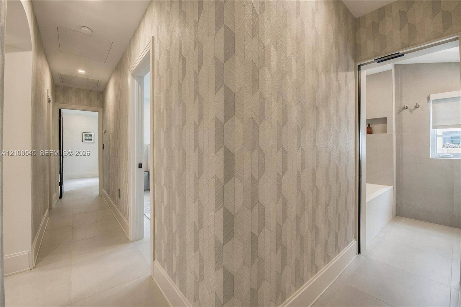 1042 NE 95th Street, Miami Shores, FL 33138 Wallpapered Hallway for separate sleeping wing of residence.
