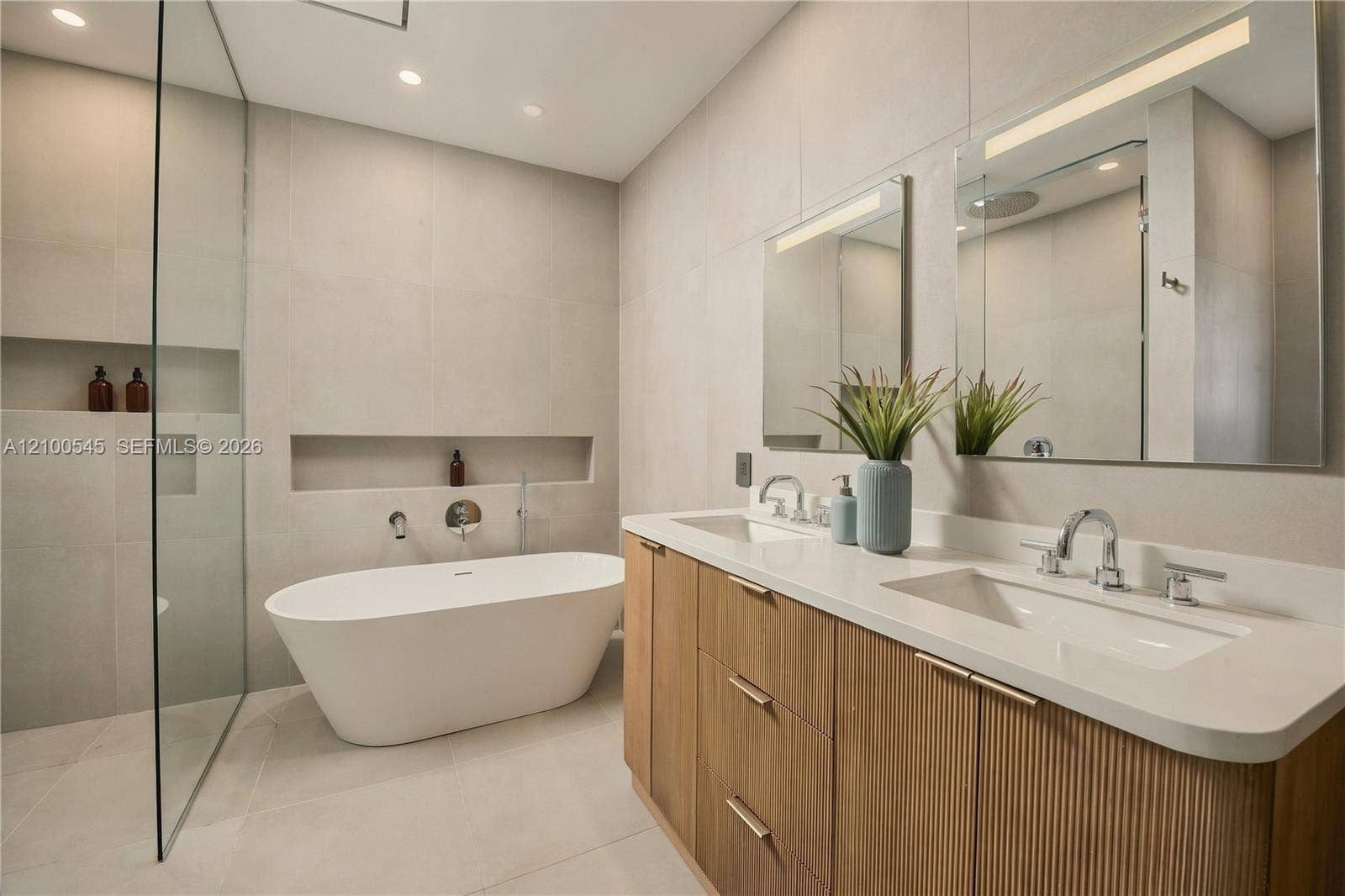 1042 NE 95th Street, Miami Shores, FL 33138 Primary Bath with double sinks, shower and bathtub.
