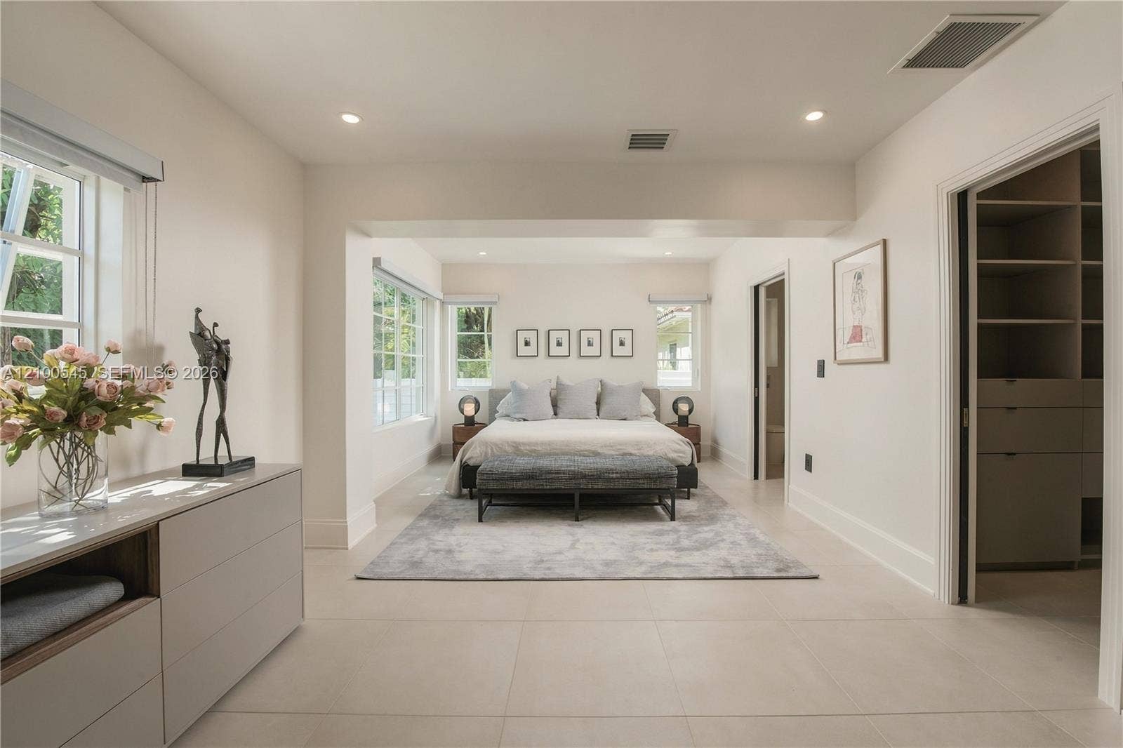 1042 NE 95th Street, Miami Shores, FL 33138 Sunlit Primary Bedroom with direct pool access.