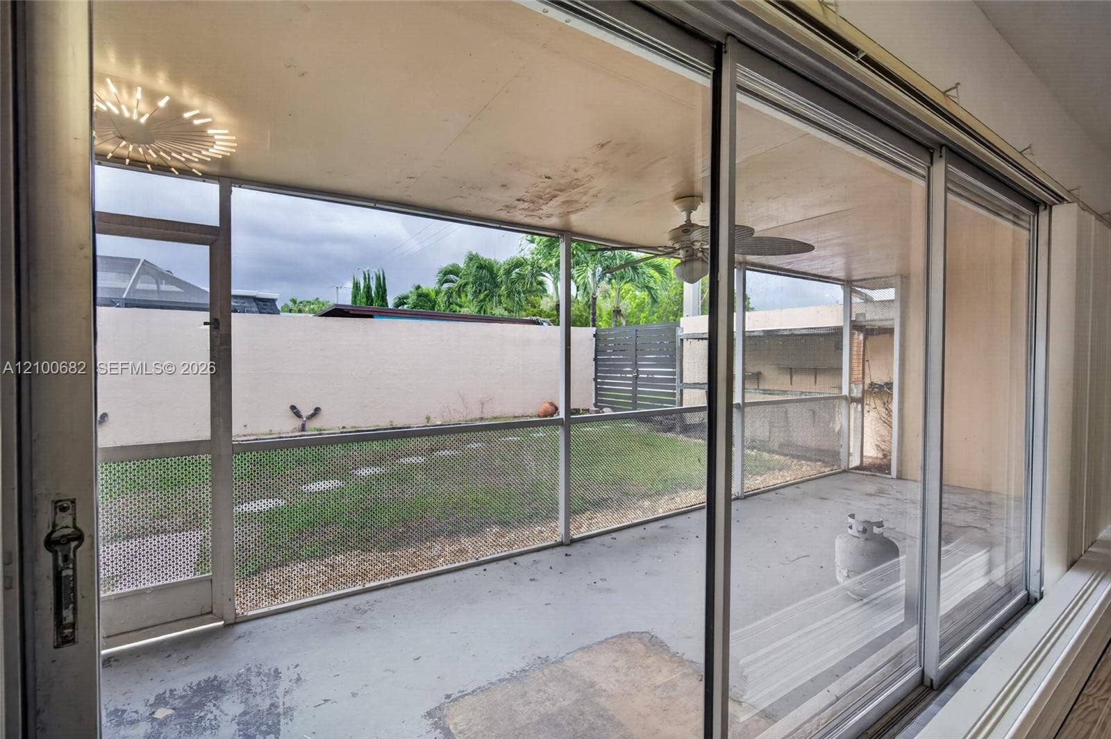 8402 SW 102nd Court, Miami, FL 33173 Screened-in patio with concrete flooringview access to a fenced yard *