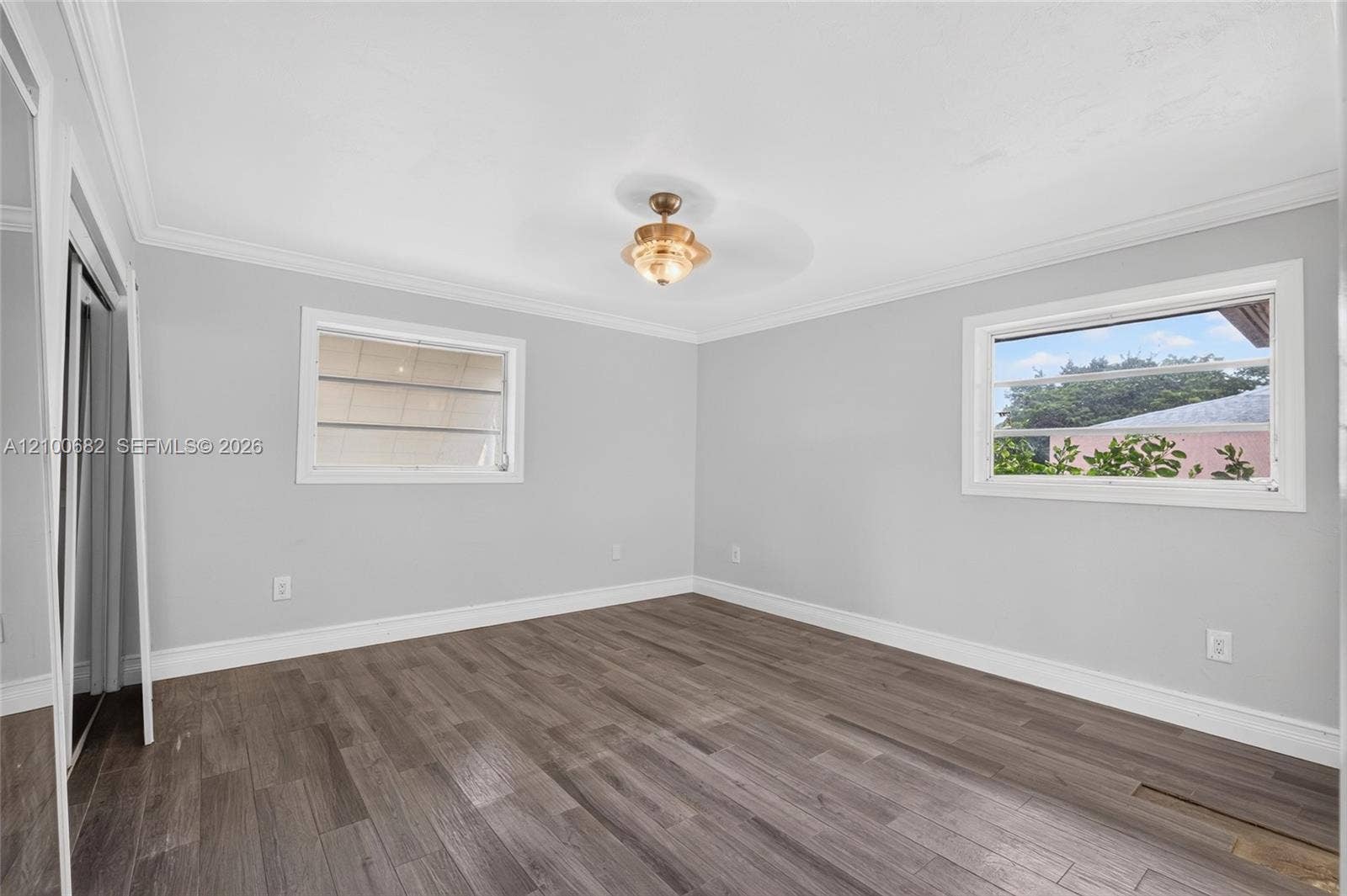 8402 SW 102nd Court, Miami, FL 33173 Main bedroom featuring crown molding, newer baseboards and framed windows *