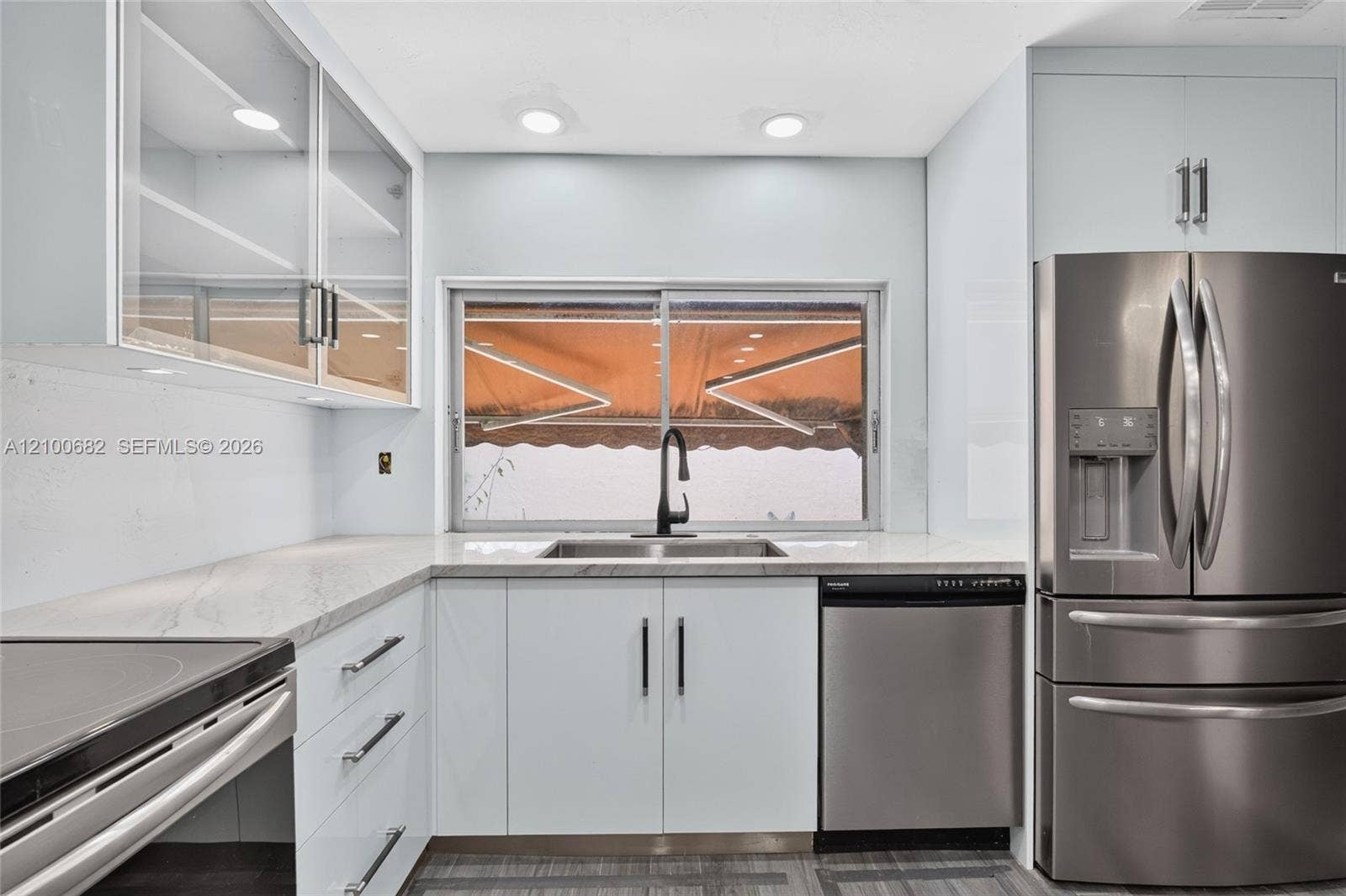 8402 SW 102nd Court, Miami, FL 33173 Kitchen featuring with views to the back yard through the large window over the sink*