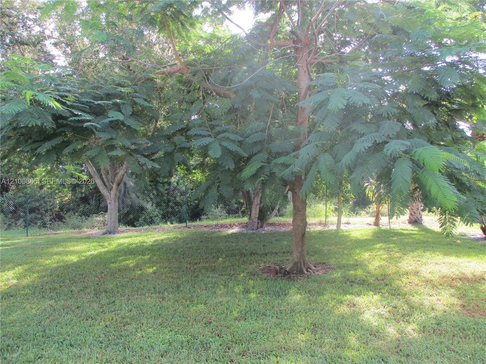 6531 SE Federal Highway, #J112, Stuart, FL 34997 Expansive lot featuring mature trees and established landscaping