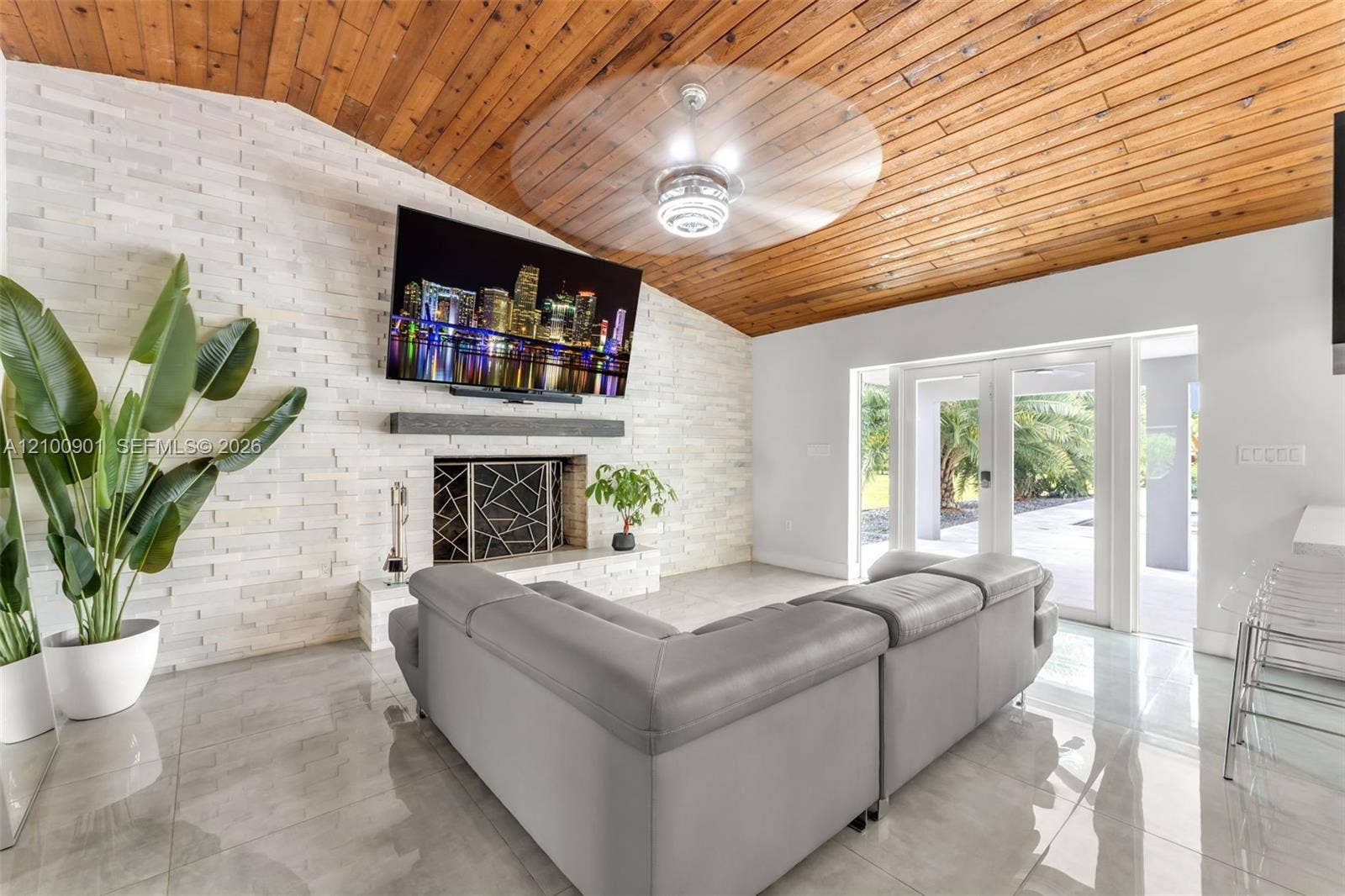 OPENS TO POOL/COVERED PATIO. 1 OF 4 SMART TVS