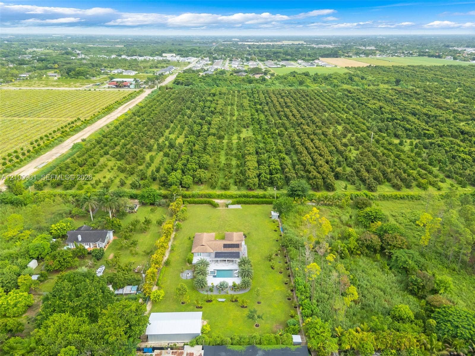NEIGHBORHOOD IS PRIVATE.... OVERHEAD VIEW OF OUR RANCH HOUSE, POOL/PATIO AND LARGE STEEL BLDG ELECTRIC GATES OPEN TO GRASS DRIVEWAY