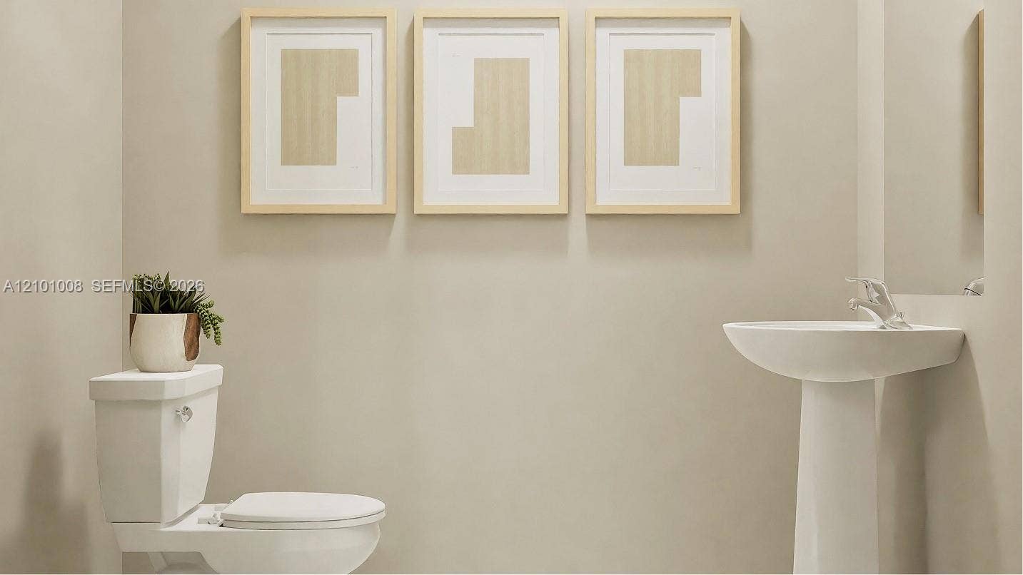Centrally located on the first floor is a powder room to provide convenience and functionality to the home.