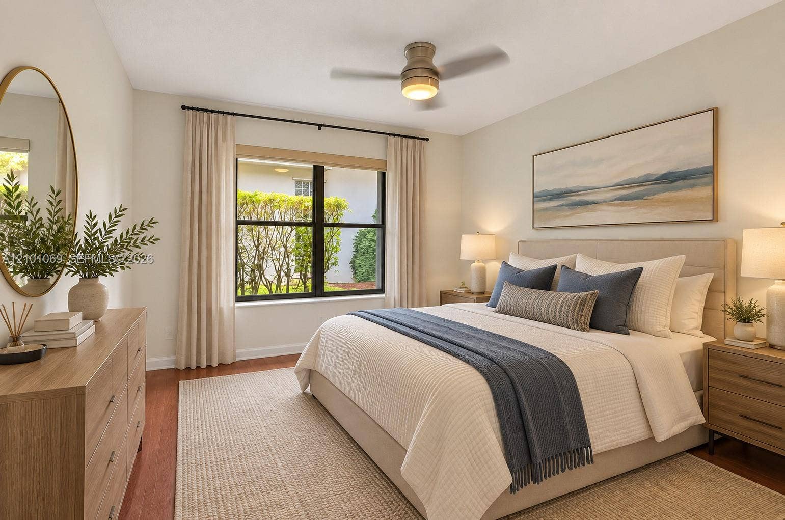 Room featuring wood-finish flooring, a ceiling fan with integrated lighting, a rectangular window with dark framing, and neutral wall tones -virtually staged