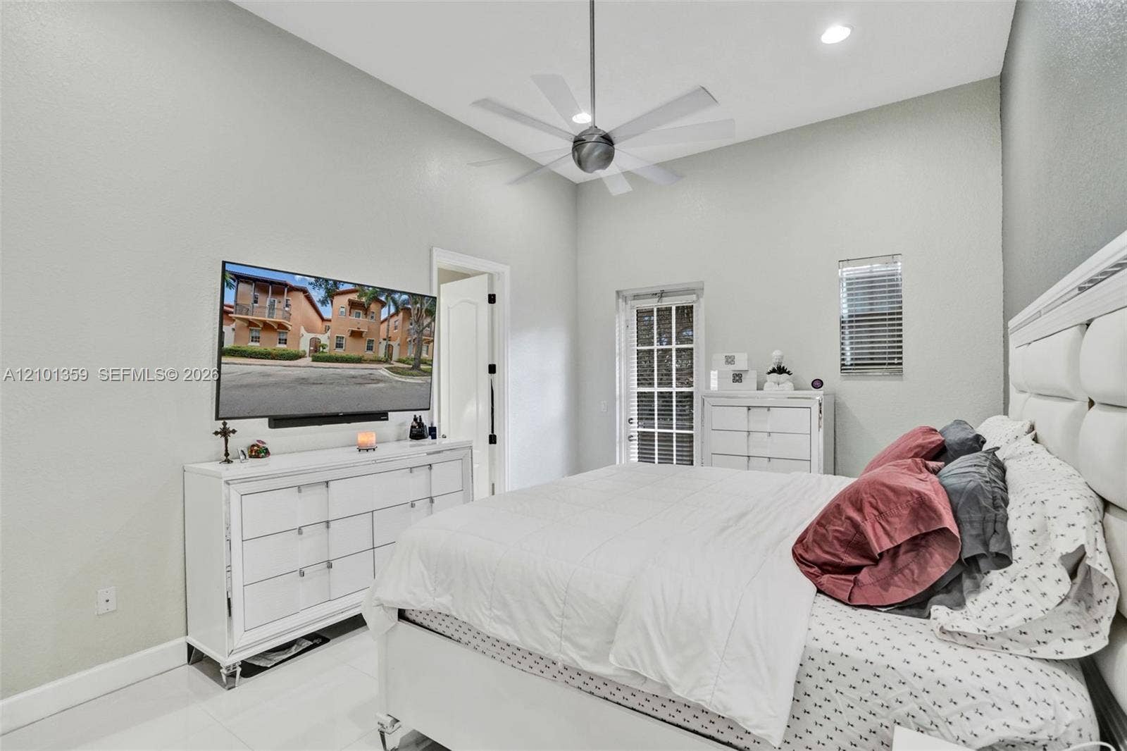 859 SW 147th Terrace, #0, Pembroke Pines, FL 33027 High-ceiling room featuring recessed lighting, a multi-blade ceiling fan, light-toned flooring, and a glass-paneled exterior door
