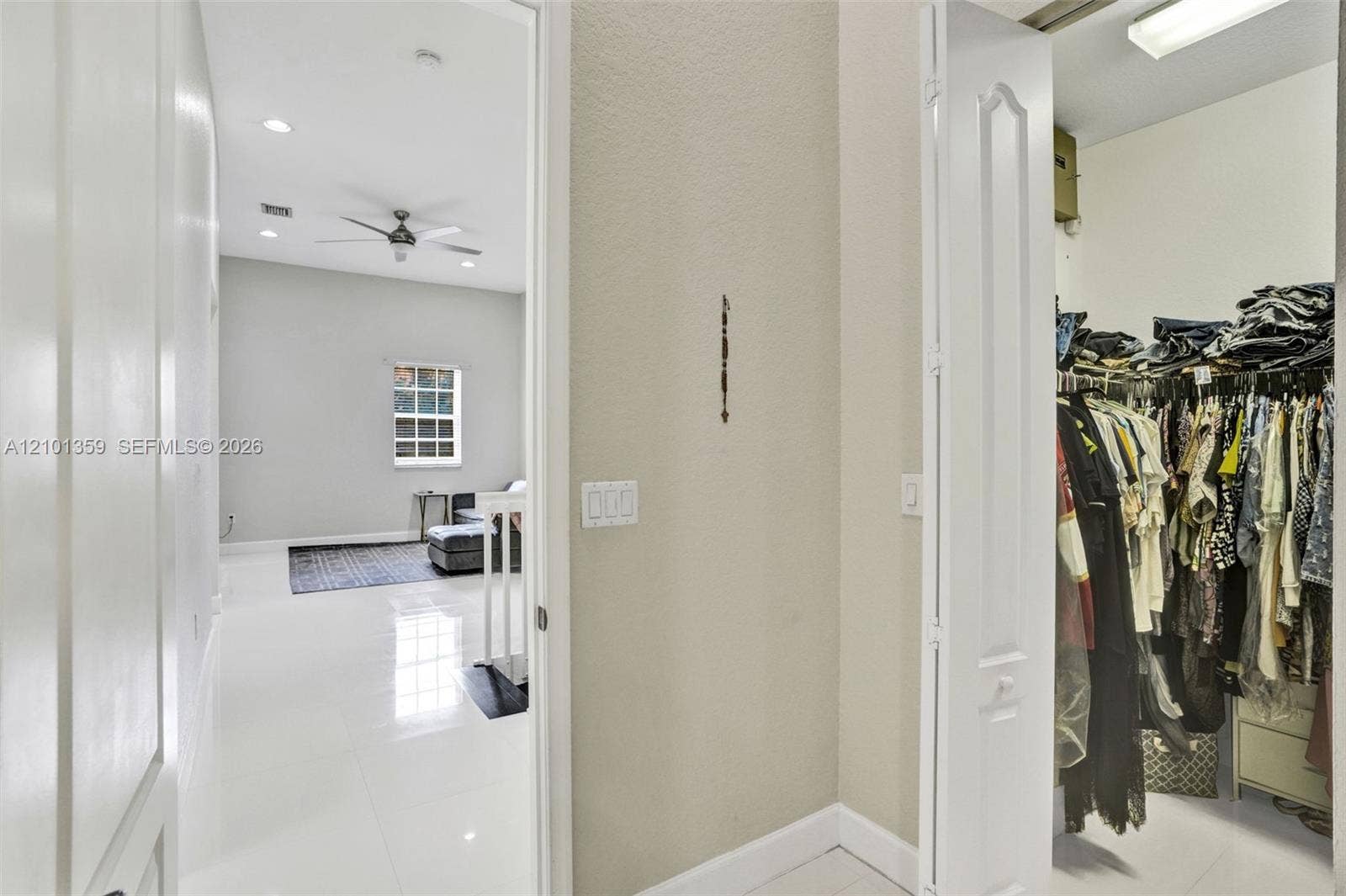 859 SW 147th Terrace, #0, Pembroke Pines, FL 33027 High-gloss tile flooring, recessed ceiling lighting, ceiling fan, and walk-in closet with built-in shelving