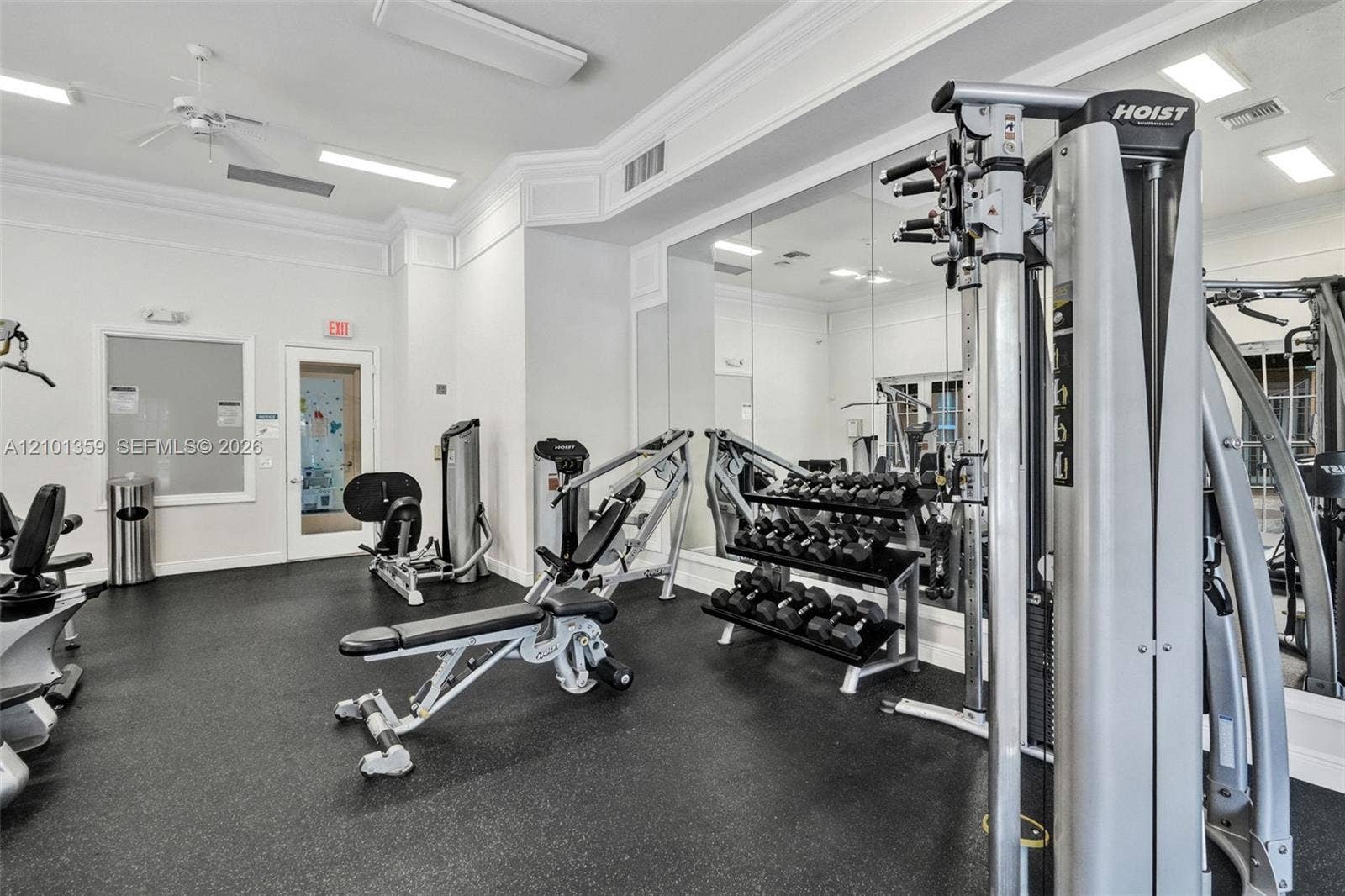 859 SW 147th Terrace, #0, Pembroke Pines, FL 33027 Fitness room featuring wall-to-wall mirrors, recessed lighting, crown molding, and rubberized flooring