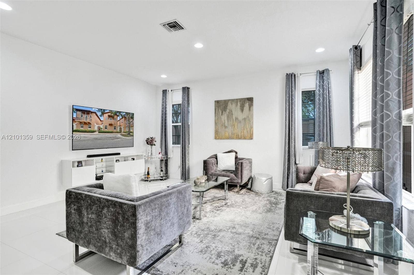 859 SW 147th Terrace, #0, Pembroke Pines, FL 33027 Living area featuring neutral wall tones, large-format tile flooring, and recessed ceiling lighting