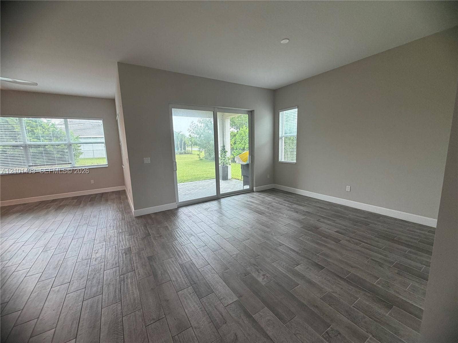 Wood-finish flooring throughout, paired with neutral wall tones