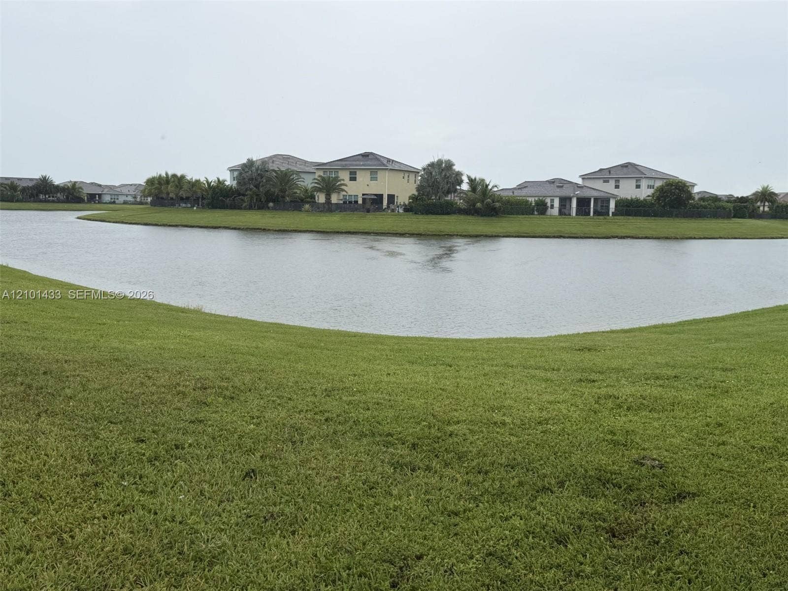 Expansive green space with a water feature