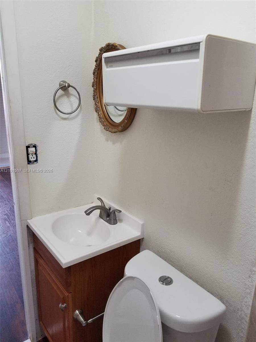 8960 Sunset Strip, Sunrise, FL 33322 Bathroom 4 - oval mirror and vanity