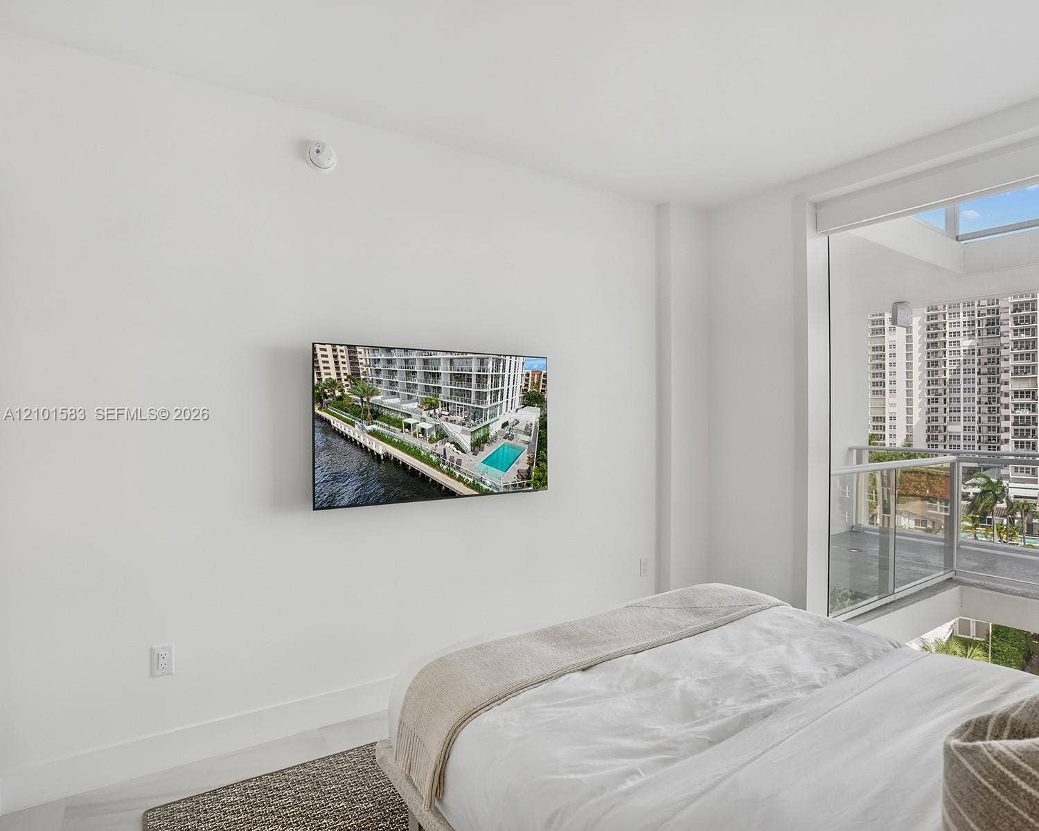 407 N Riverside Drive, #604, Pompano Beach, Pompano Beach, FL 33062 Floor-to-ceiling windows with integrated glass balcony railing and neutral flooring