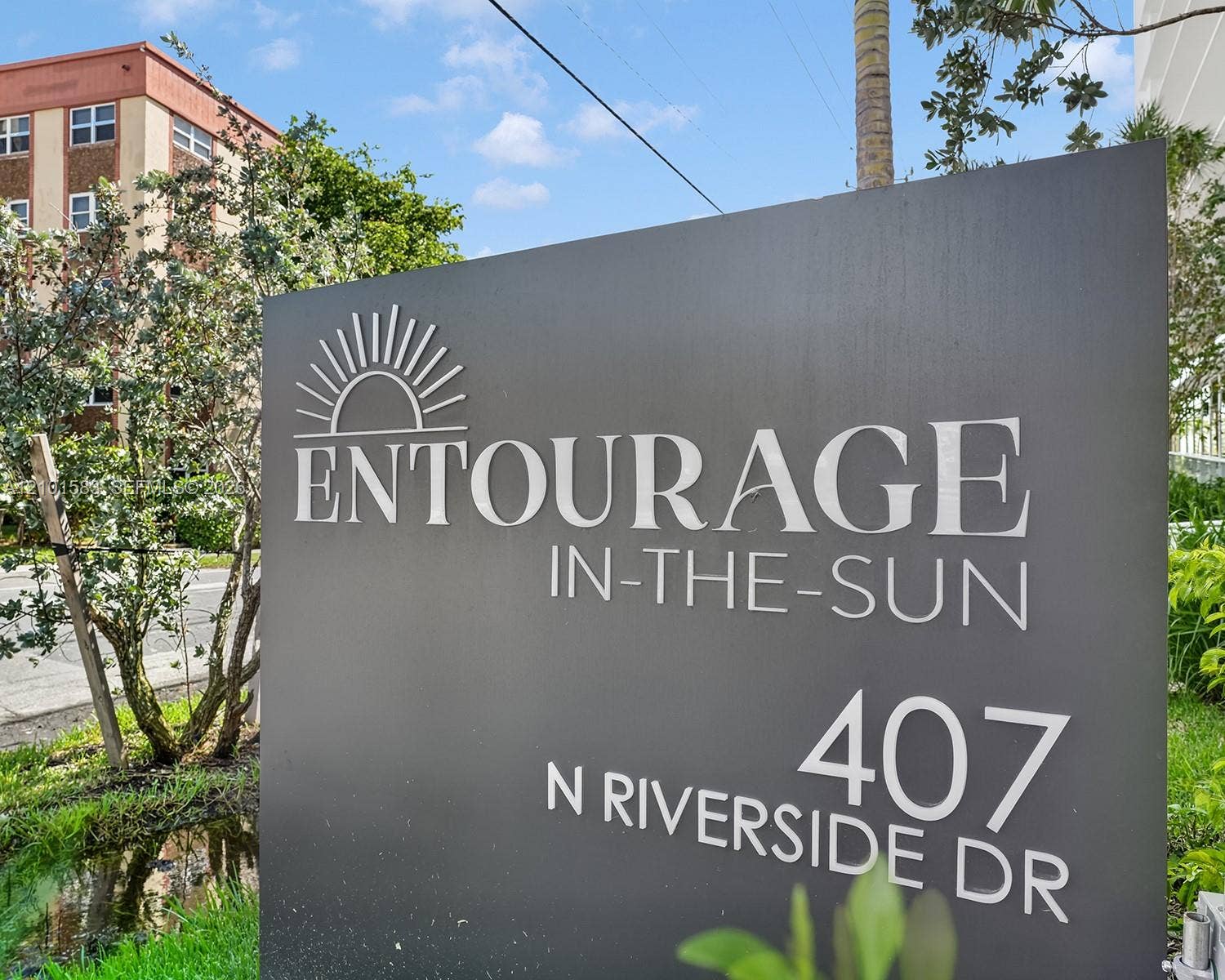 407 N Riverside Drive, #604, Pompano Beach, Pompano Beach, FL 33062 Ground-mounted signage featuring dimensional lettering on a charcoal-finished monument sign