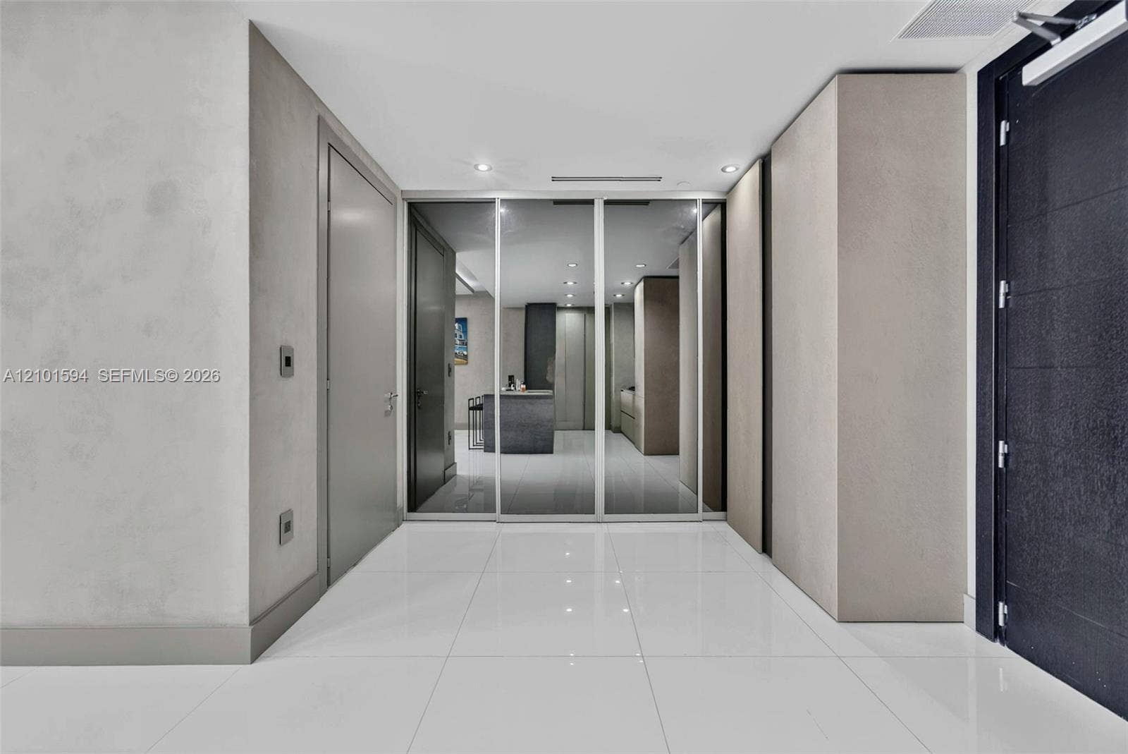 Entry and interior hall with sleek built-in storage.