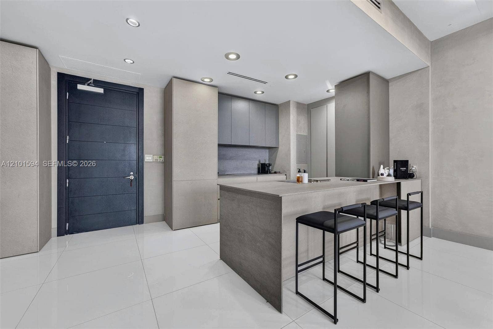 Kitchen island with seating and direct connection to the main living area.