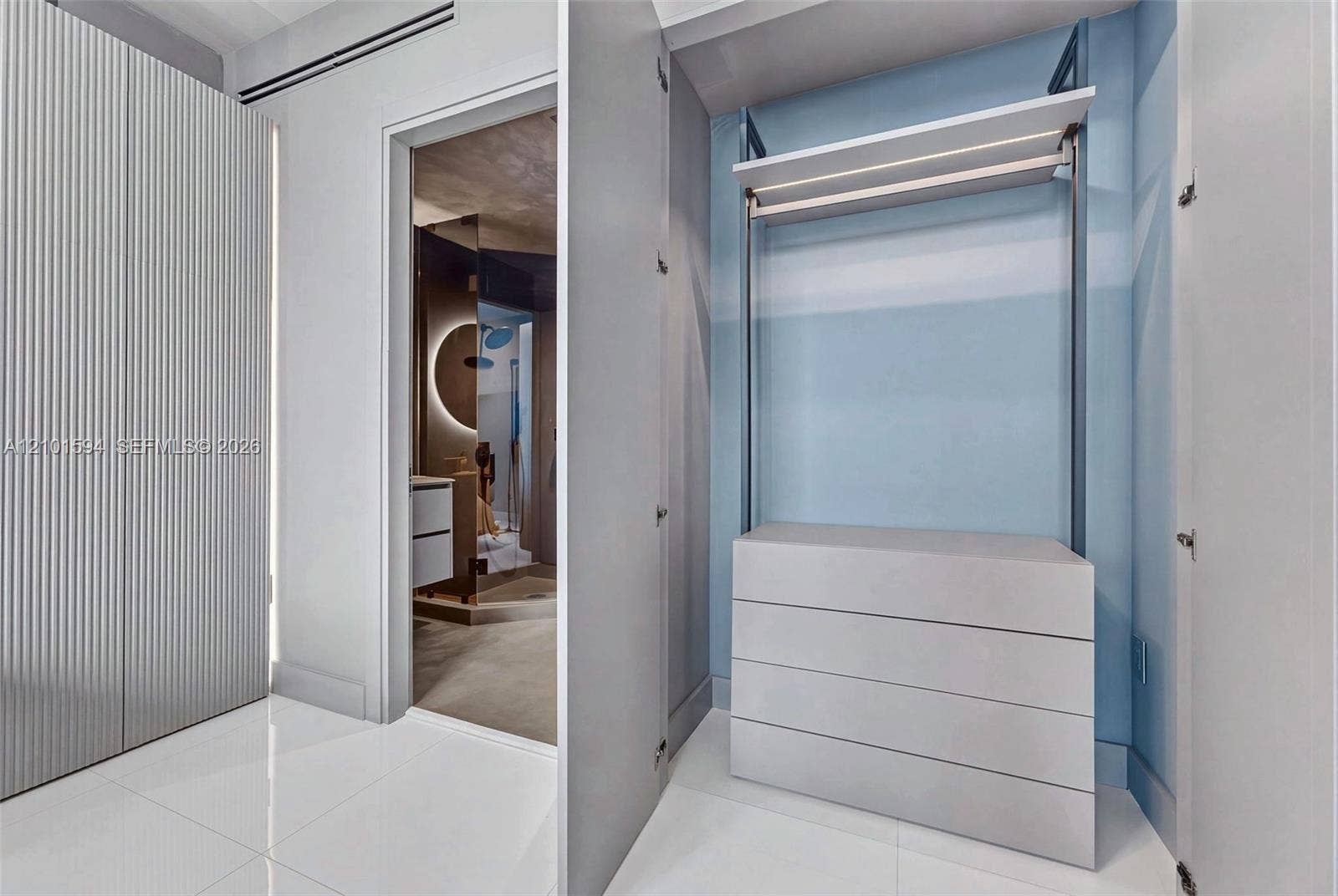 Additional custom closet with built-in shelving and organized storage.
