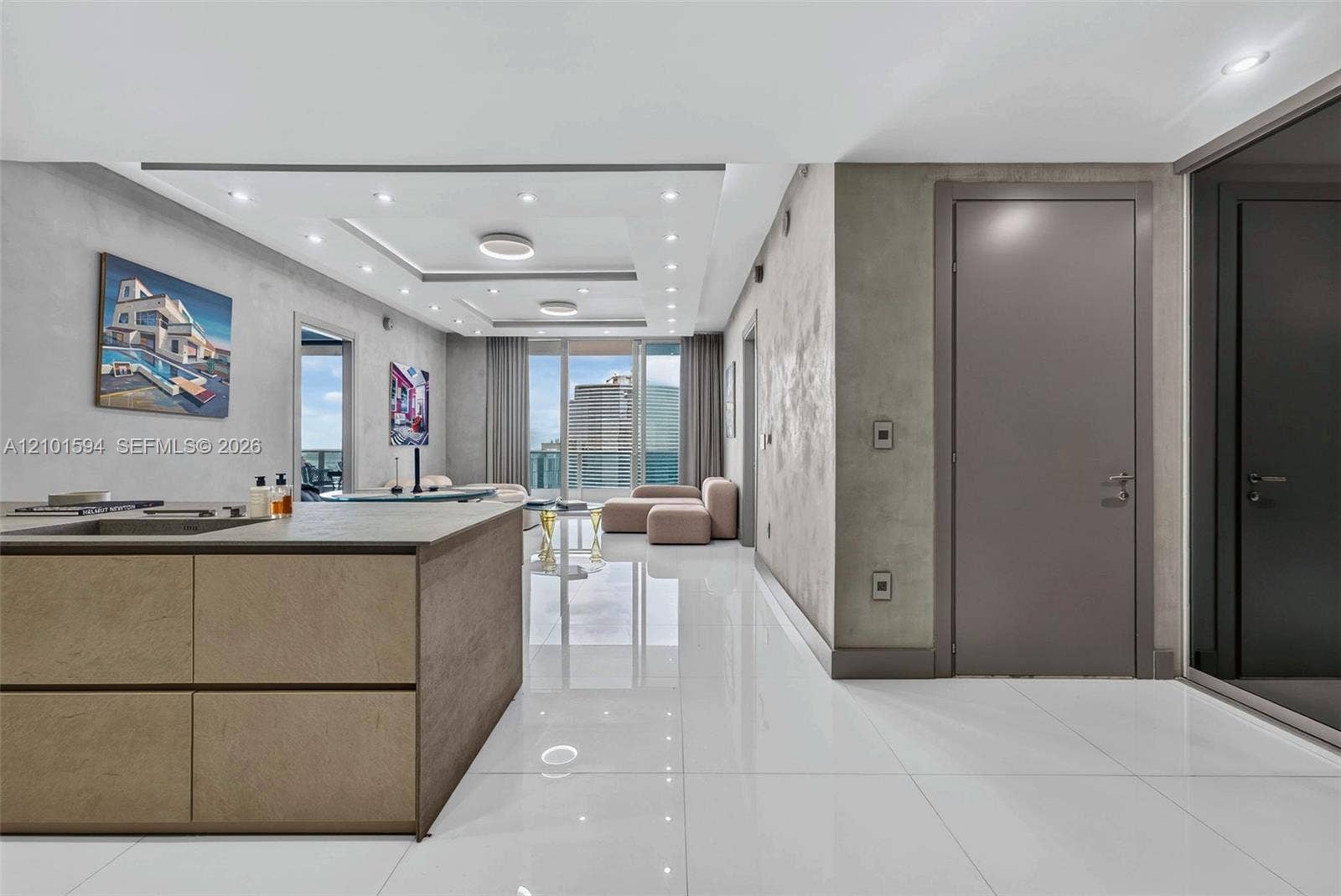 Kitchen and living area with clean contemporary finishes and open sightlines.