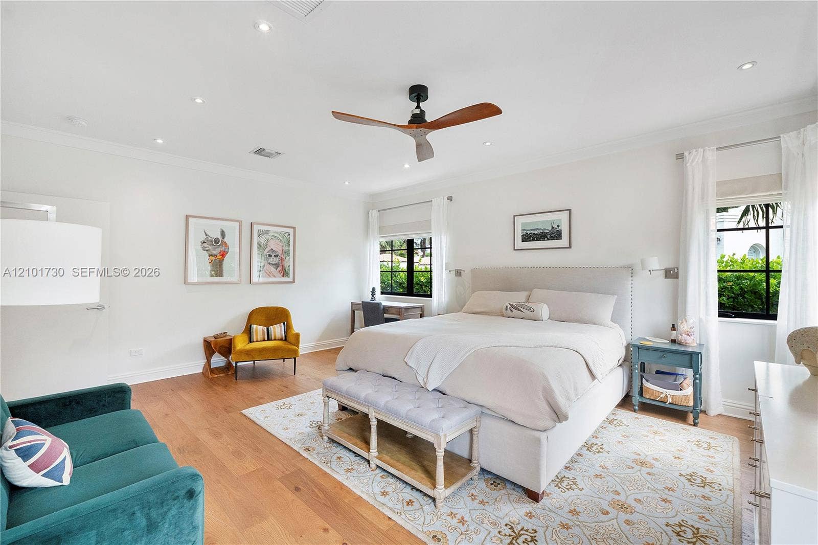 435 W 51st Street, Miami Beach, FL 33140 Spacious room featuring wood-finish flooring, recessed lighting, crown molding, a ceiling fan, and multi-pane windows