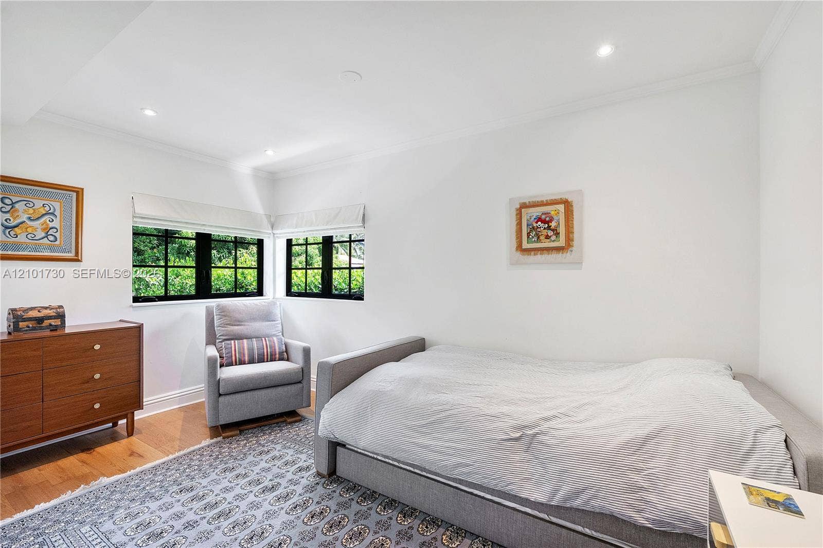 435 W 51st Street, Miami Beach, FL 33140 Corner room featuring wood-finish flooring, recessed lighting, and black-framed multi-pane windows