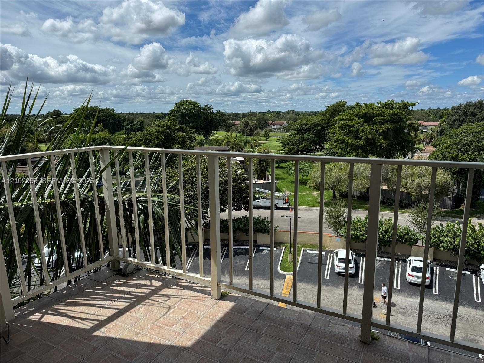 13120 SW 92nd Avenue, #B-PH1, Miami, Miami, FL 33176 Elevated balcony featuring neutral-toned tile flooring and a white metal railing
