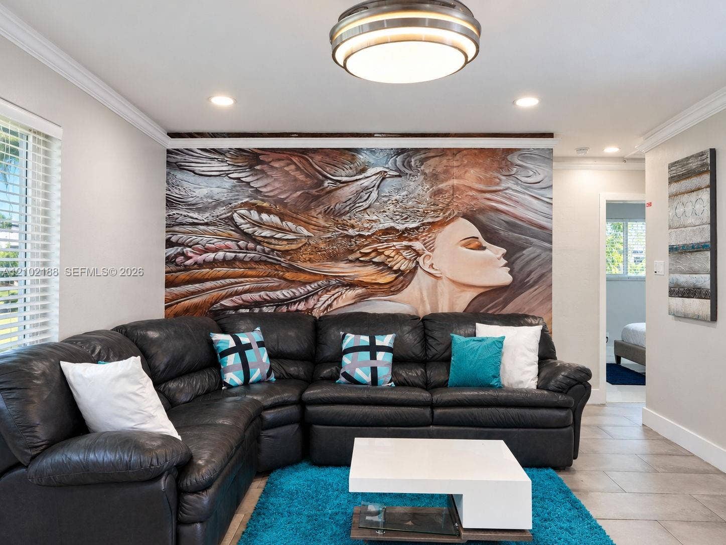 Interior space featuring crown molding, neutral wall finishes, tile flooring, and a flush-mount drum ceiling light fixture