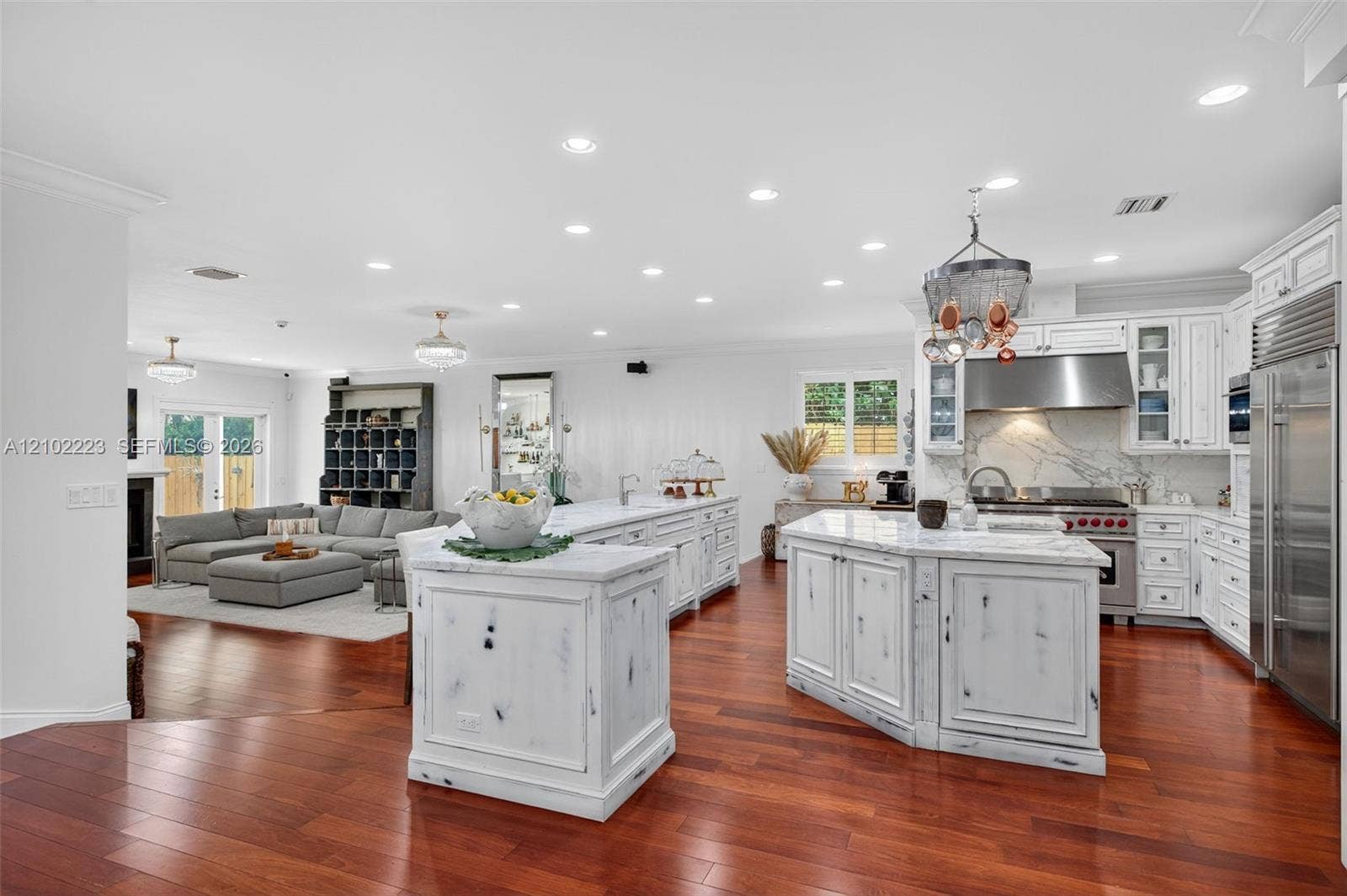An impressive open concept chefs kitchen, both expensive countertops, a generous, entertaining bar and a Spacious Center, Island perfectly designed for culinary, creativity and effortless entertaining.